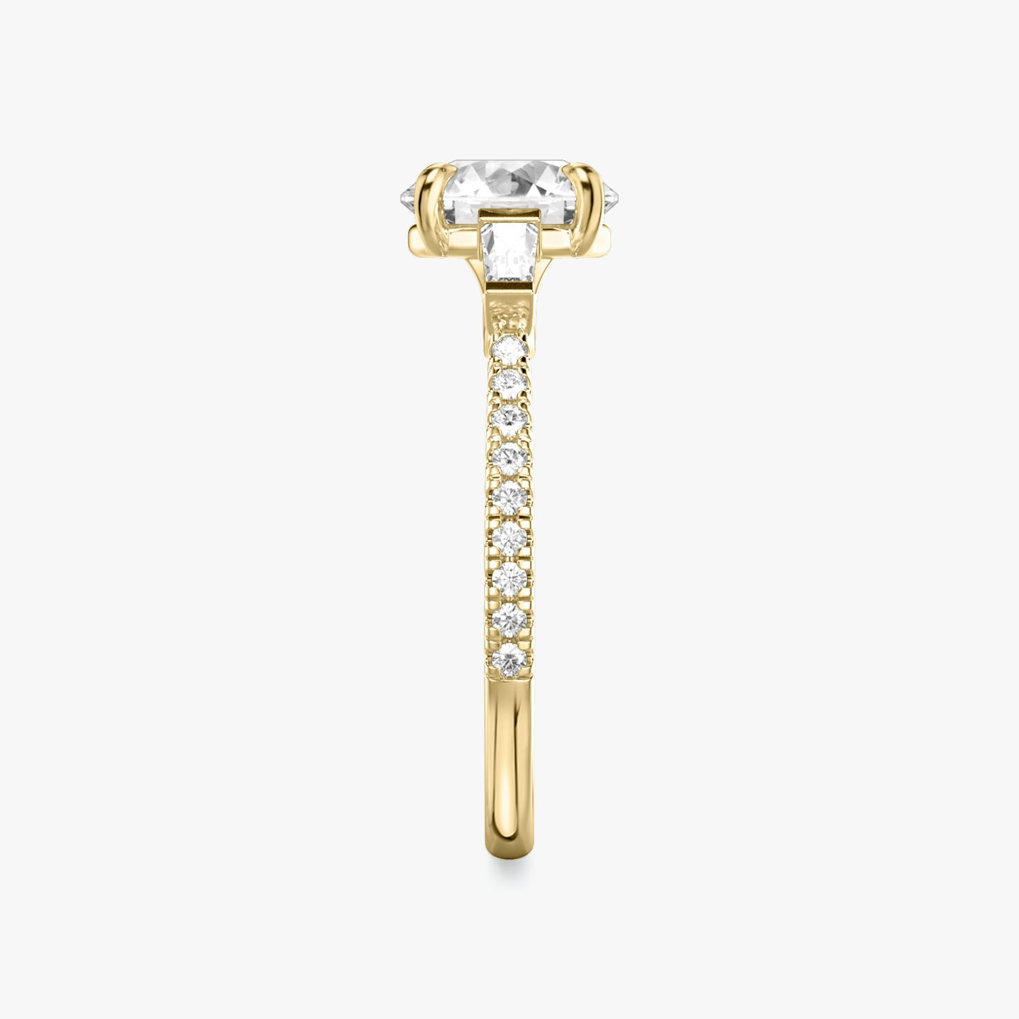 The Three Stone | Round Brilliant | 18k | Yellow Gold | bandAccent: Pavé | caratWeight: other | sideStoneCarat: 0.10ct | sideStoneShape: Tapered Baguette | diamondOrientation: vertical