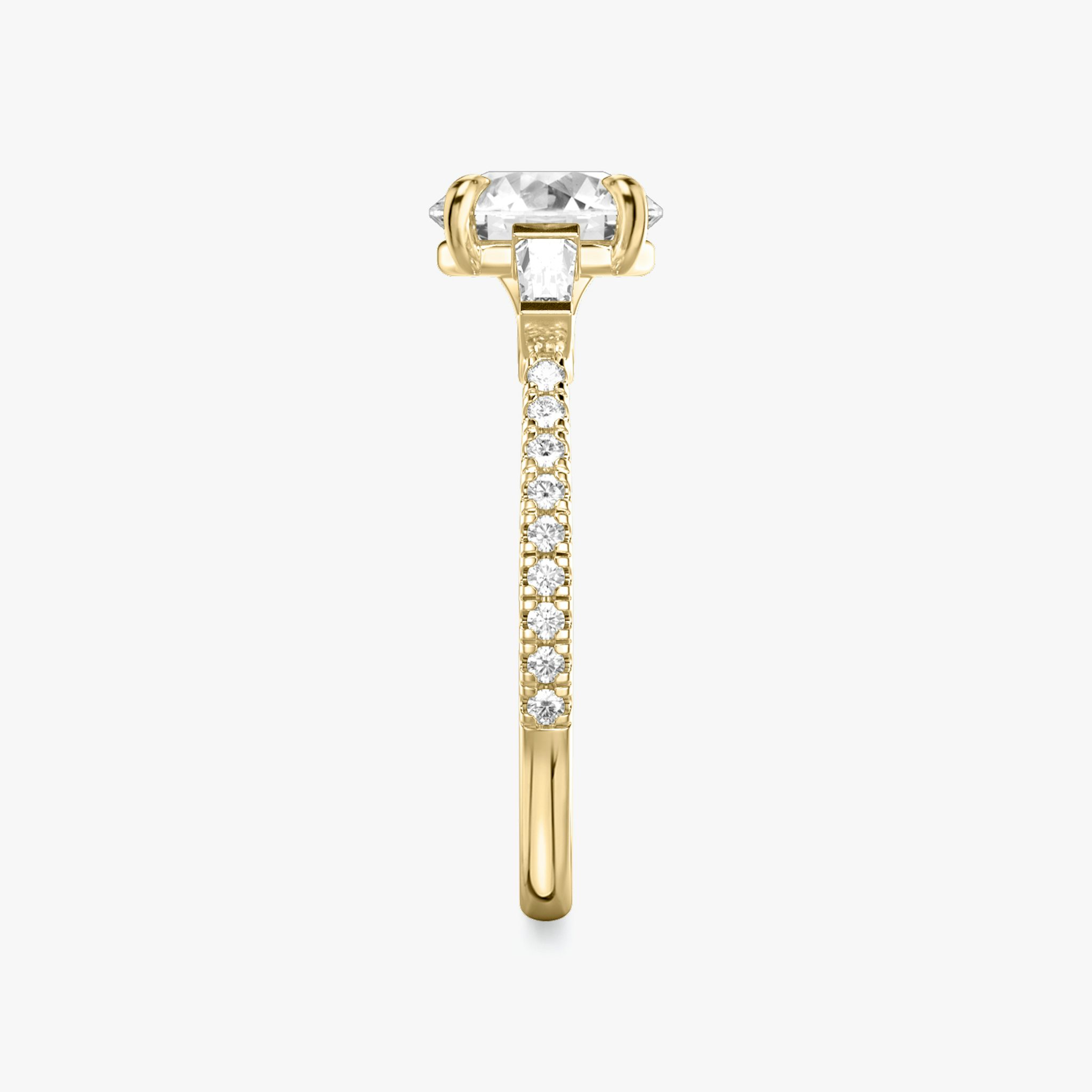 The Three Stone | Round Brilliant | 18k | Yellow Gold | bandAccent: Pavé | caratWeight: other | sideStoneCarat: 0.10ct | sideStoneShape: Tapered Baguette | diamondOrientation: vertical