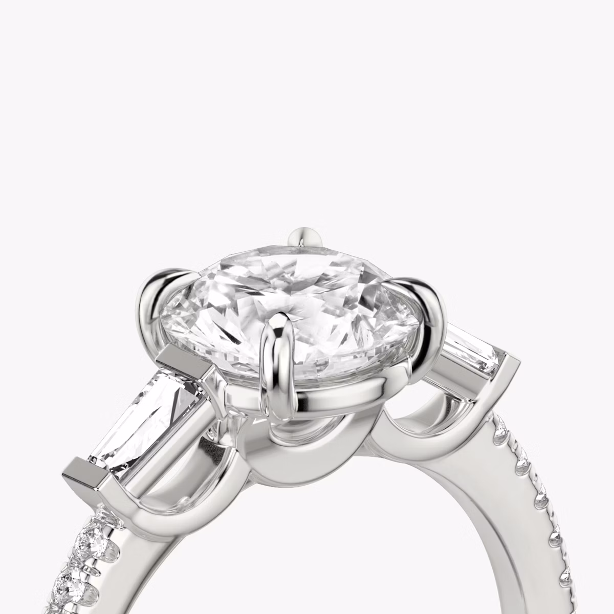 The Three Stone | Round Brilliant | 18k | White Gold | bandAccent: Pavé | caratWeight: other | sideStoneCarat: 0.10ct | sideStoneShape: Tapered Baguette | diamondOrientation: vertical