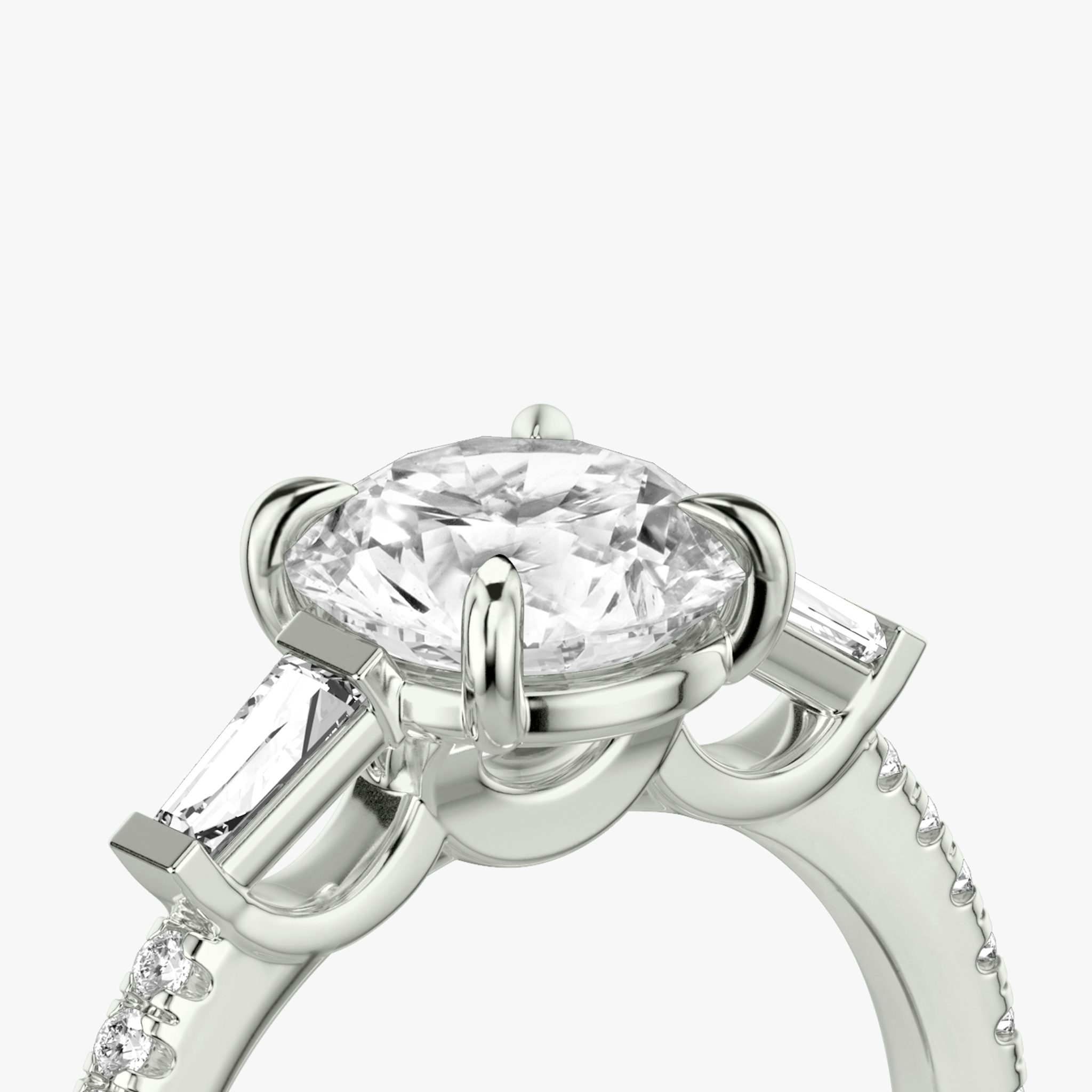 The Three Stone | Round Brilliant | Platinum | bandAccent: Pavé | caratWeight: other | sideStoneCarat: 0.10ct | sideStoneShape: Tapered Baguette | diamondOrientation: vertical