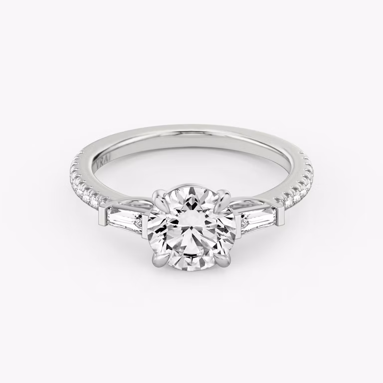 The Tapered Baguette Three Stone Round Brilliant White Gold Engagement Ring laying flat.