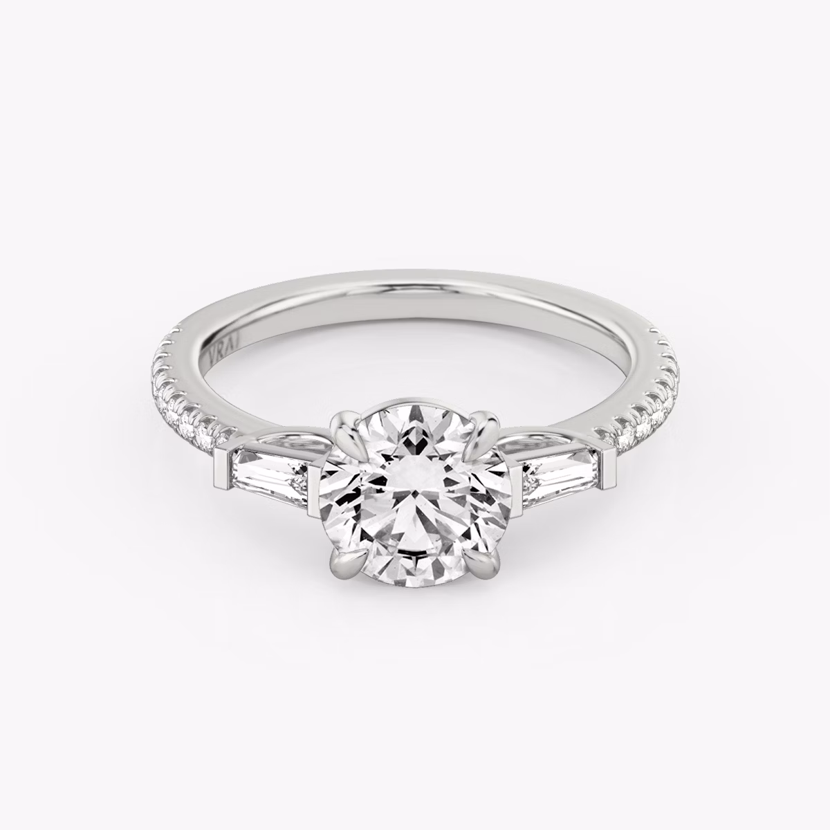The Three Stone | Round Brilliant | 18k | White Gold | bandAccent: Pavé | caratWeight: other | sideStoneCarat: 0.10ct | sideStoneShape: Tapered Baguette | diamondOrientation: vertical