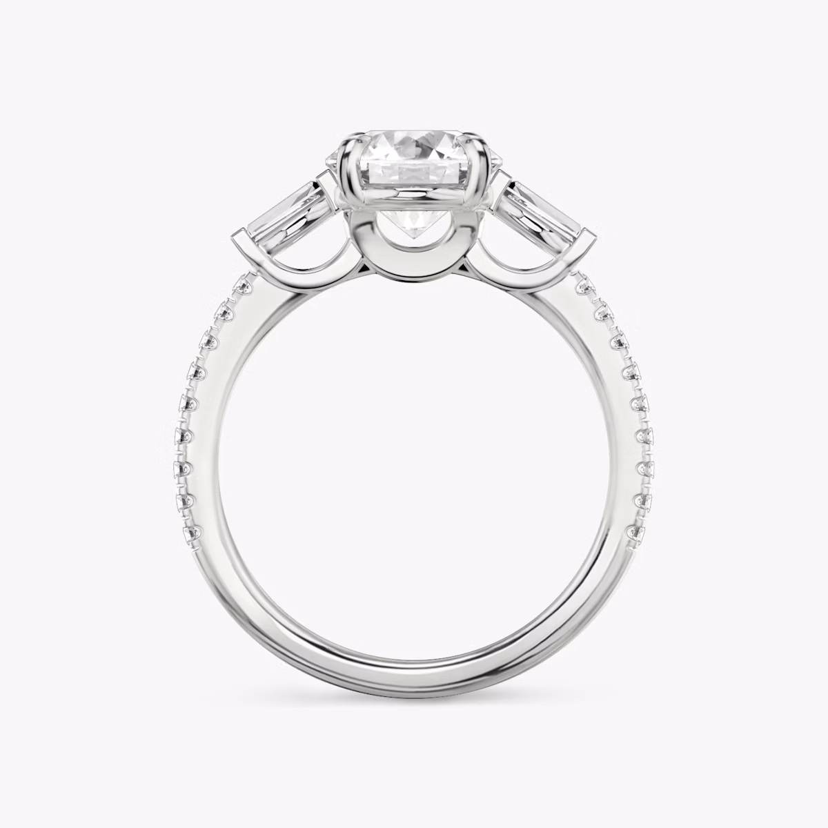 The Three Stone | Round Brilliant | 18k | White Gold | bandAccent: Pavé | caratWeight: other | sideStoneCarat: 0.10ct | sideStoneShape: Tapered Baguette | diamondOrientation: vertical