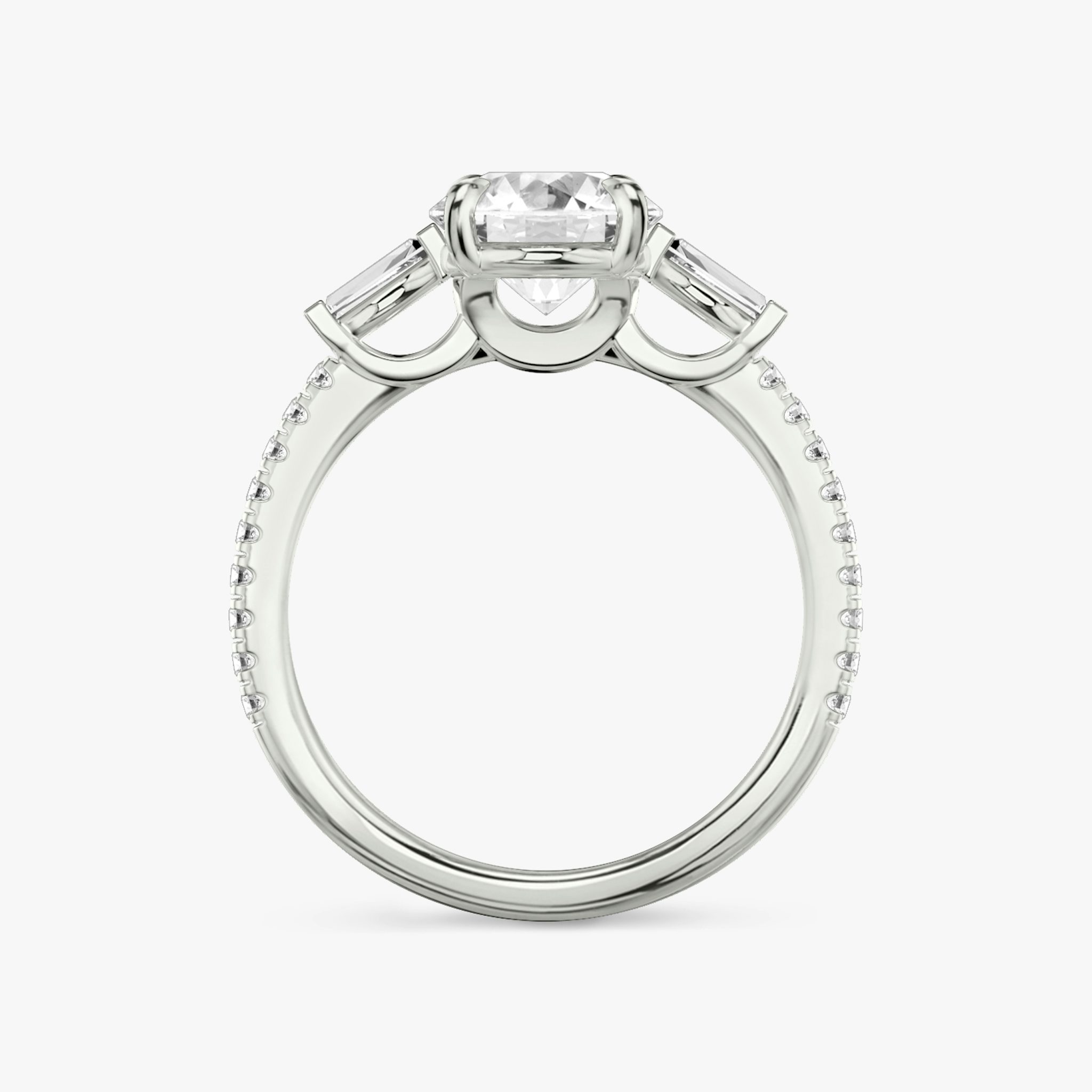 The Three Stone | Round Brilliant | Platinum | bandAccent: Pavé | caratWeight: other | sideStoneCarat: 0.10ct | sideStoneShape: Tapered Baguette | diamondOrientation: vertical