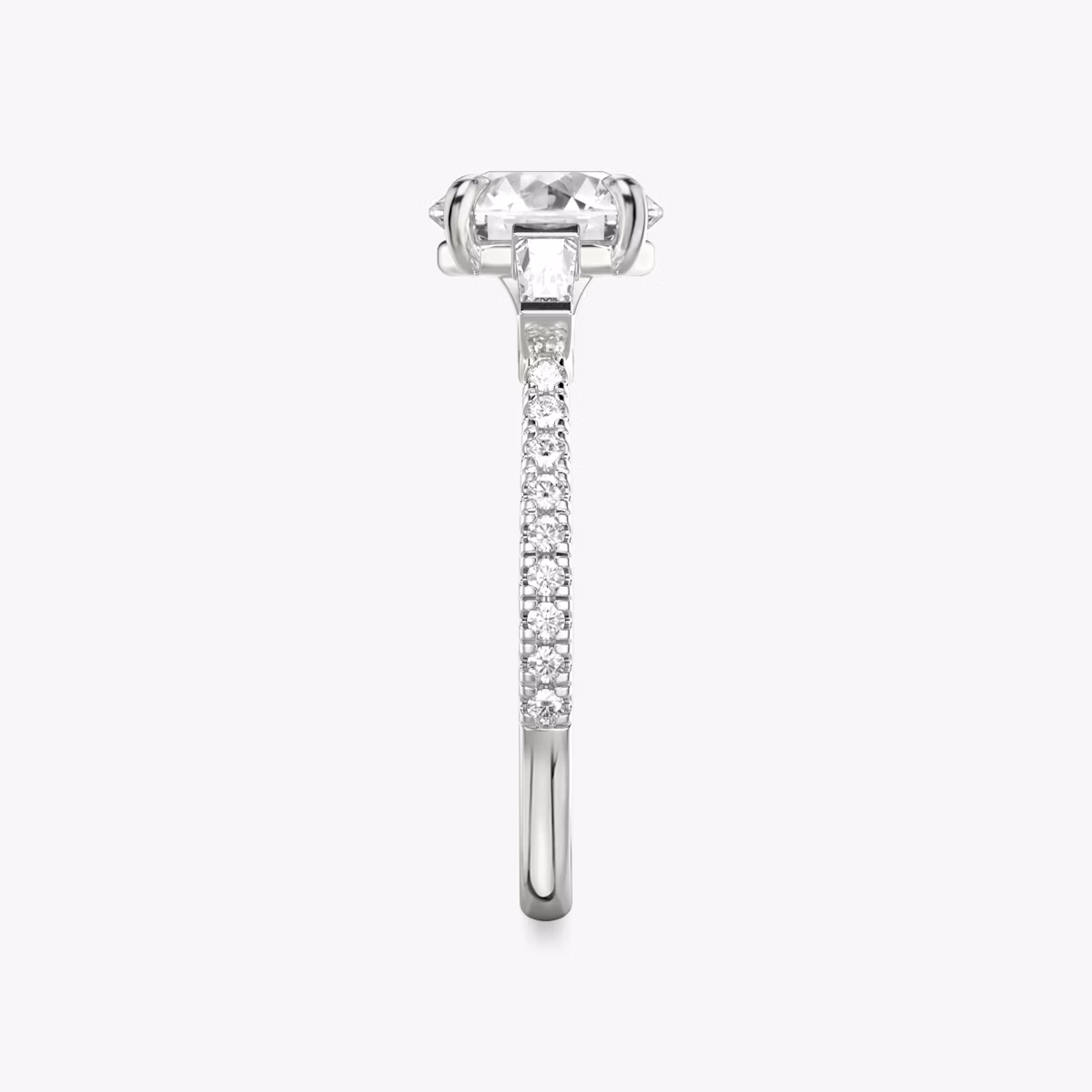 The Three Stone | Round Brilliant | 18k | White Gold | bandAccent: Pavé | caratWeight: other | sideStoneCarat: 0.10ct | sideStoneShape: Tapered Baguette | diamondOrientation: vertical