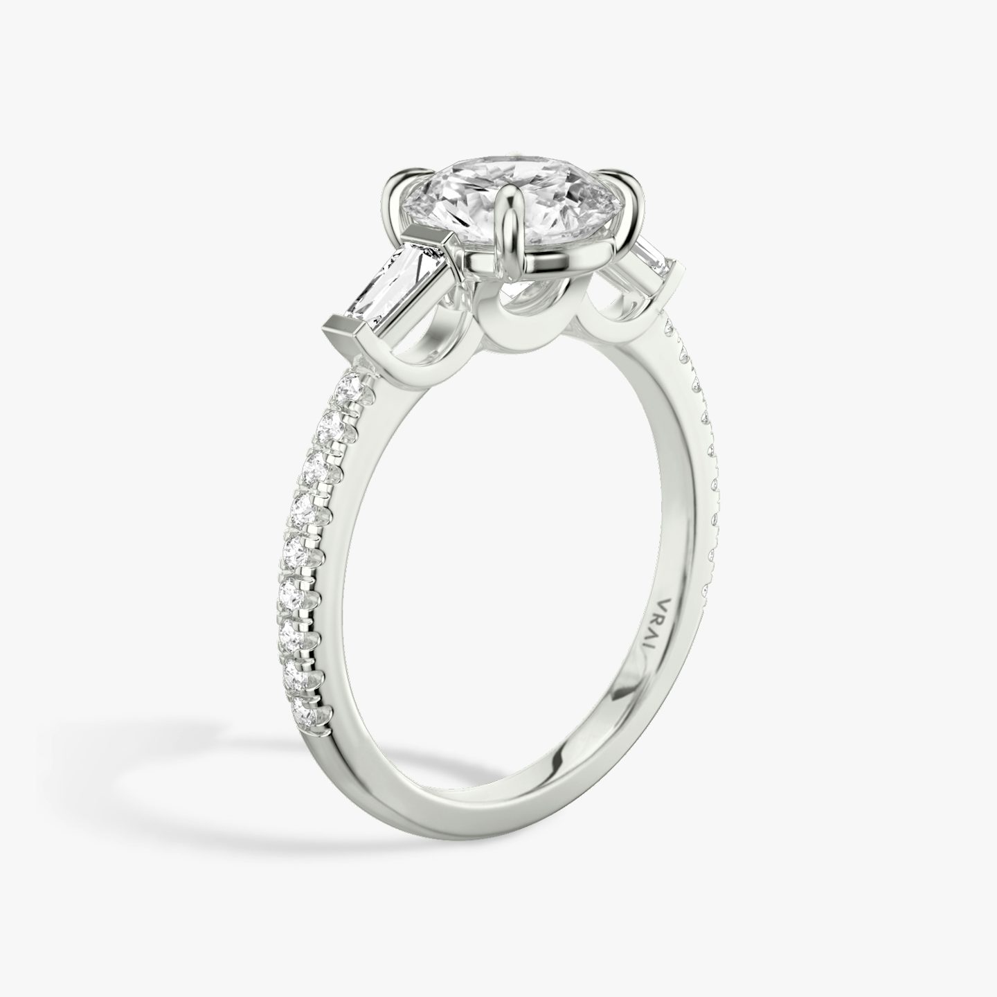 The Three Stone | Round Brilliant | 18k | White Gold | bandAccent: Pavé | caratWeight: other | sideStoneCarat: 0.10ct | sideStoneShape: Tapered Baguette | diamondOrientation: vertical