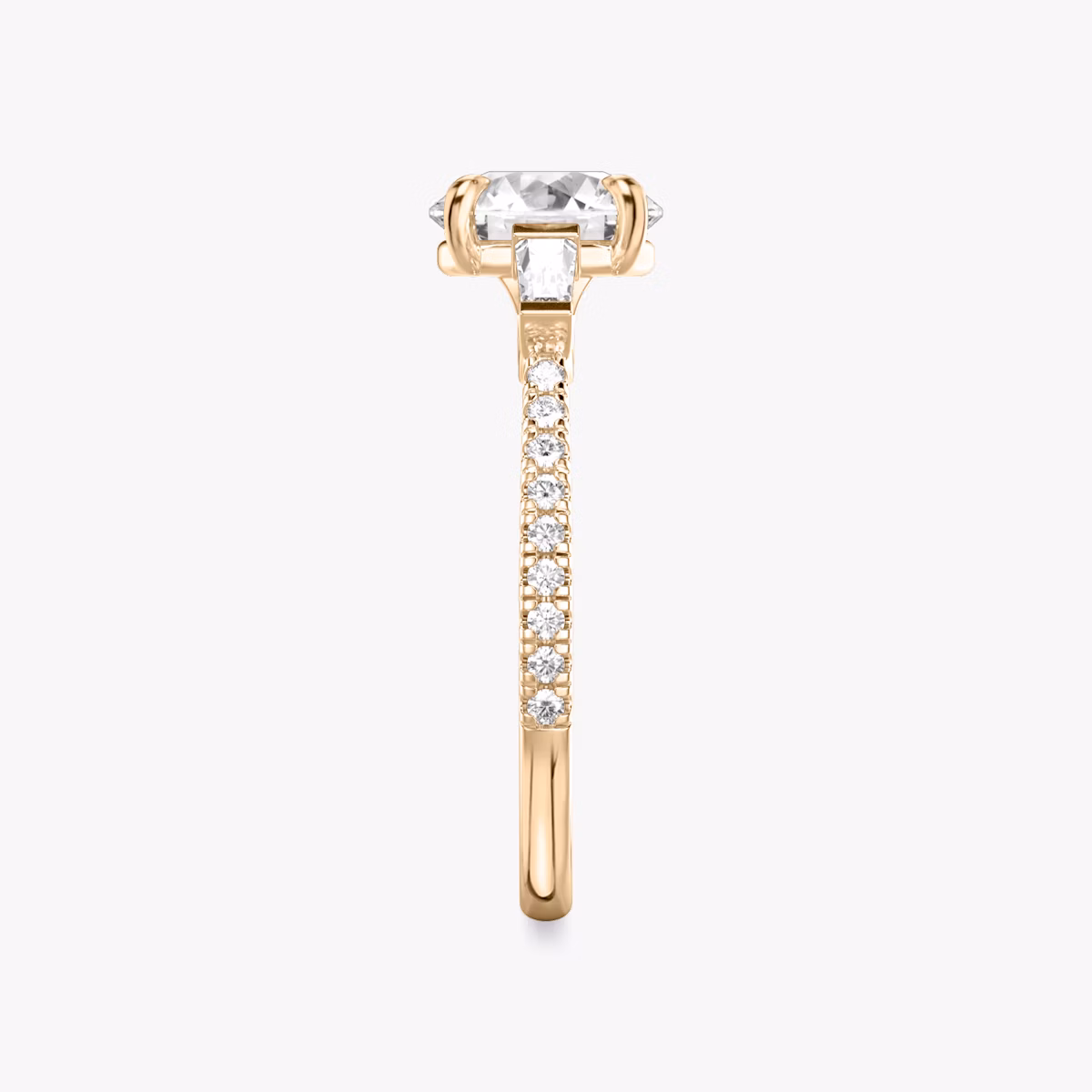 The Three Stone | Round Brilliant | 14k | Rose Gold | bandAccent: Pavé | caratWeight: other | sideStoneCarat: 0.10ct | sideStoneShape: Tapered Baguette | diamondOrientation: vertical