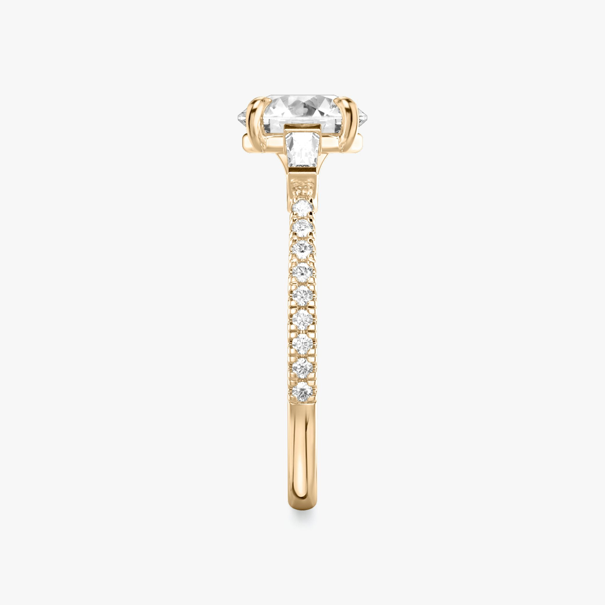 The Three Stone | Round Brilliant | 14k | Rose Gold | bandAccent: Pavé | caratWeight: other | sideStoneCarat: 0.10ct | sideStoneShape: Tapered Baguette | diamondOrientation: vertical
