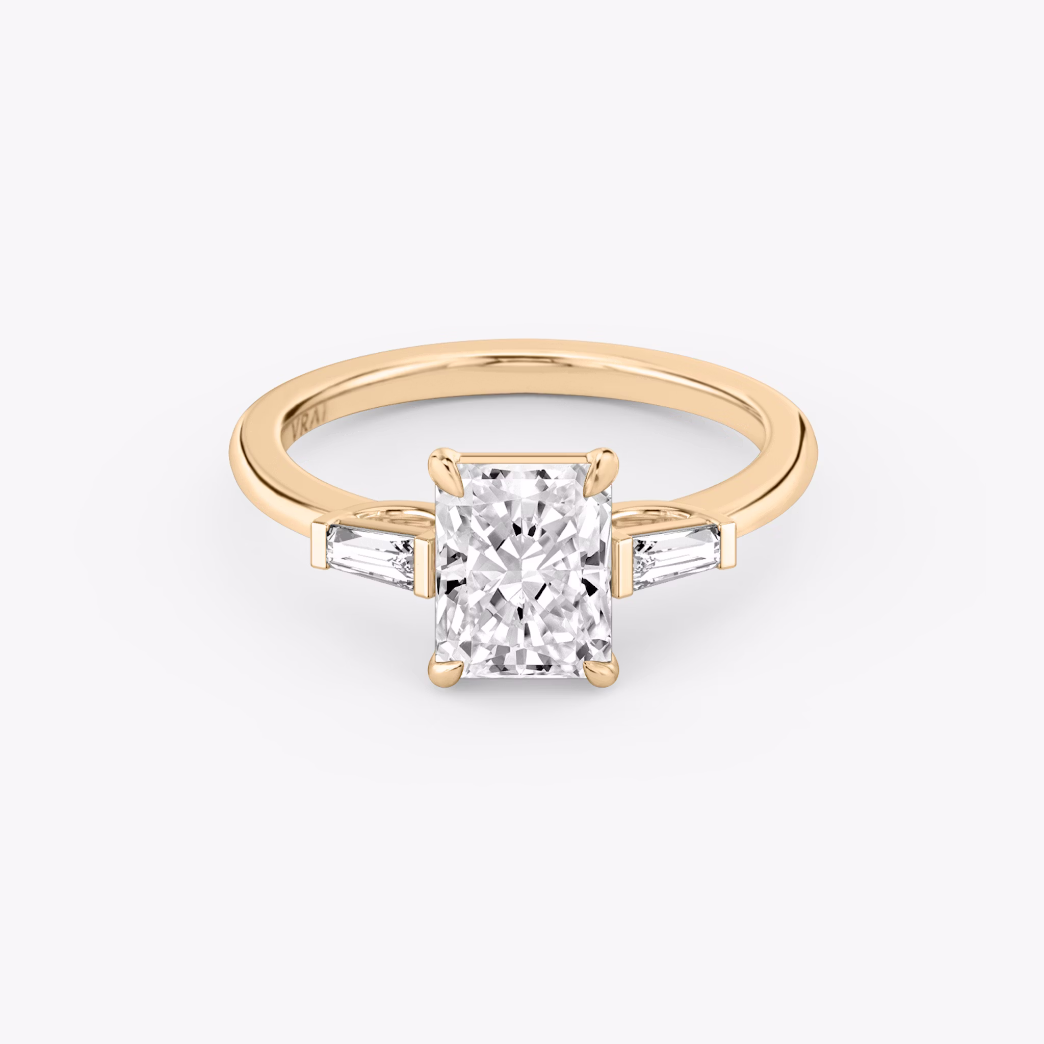 The Three Stone | Radiant | 14k | Rose Gold | bandAccent: Plain | sideStoneCarat: 0.10ct | sideStoneShape: Tapered Baguette | diamondOrientation: vertical | caratWeight: other