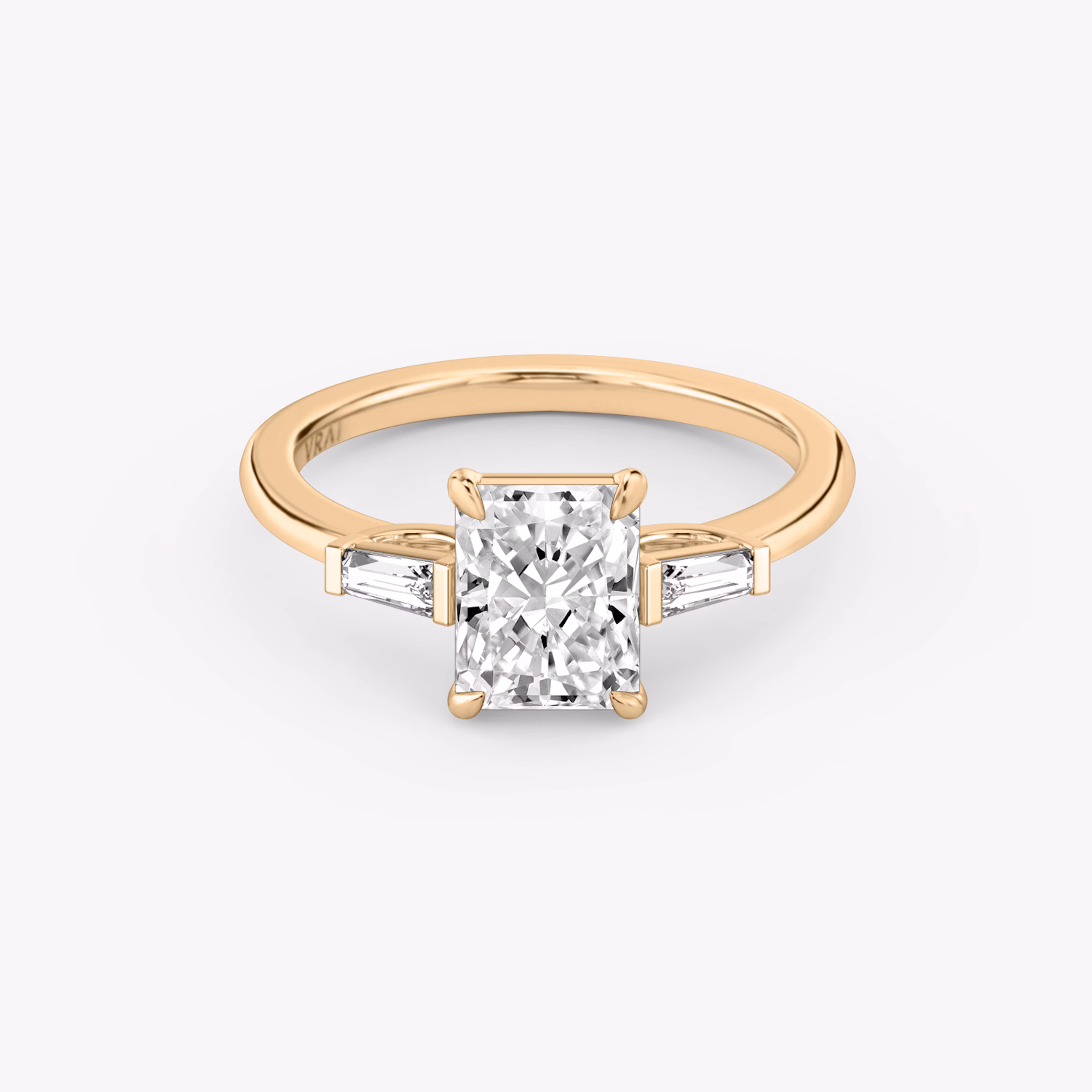 The Three Stone with Radiant and Tapered Baguette VRAI created diamonds