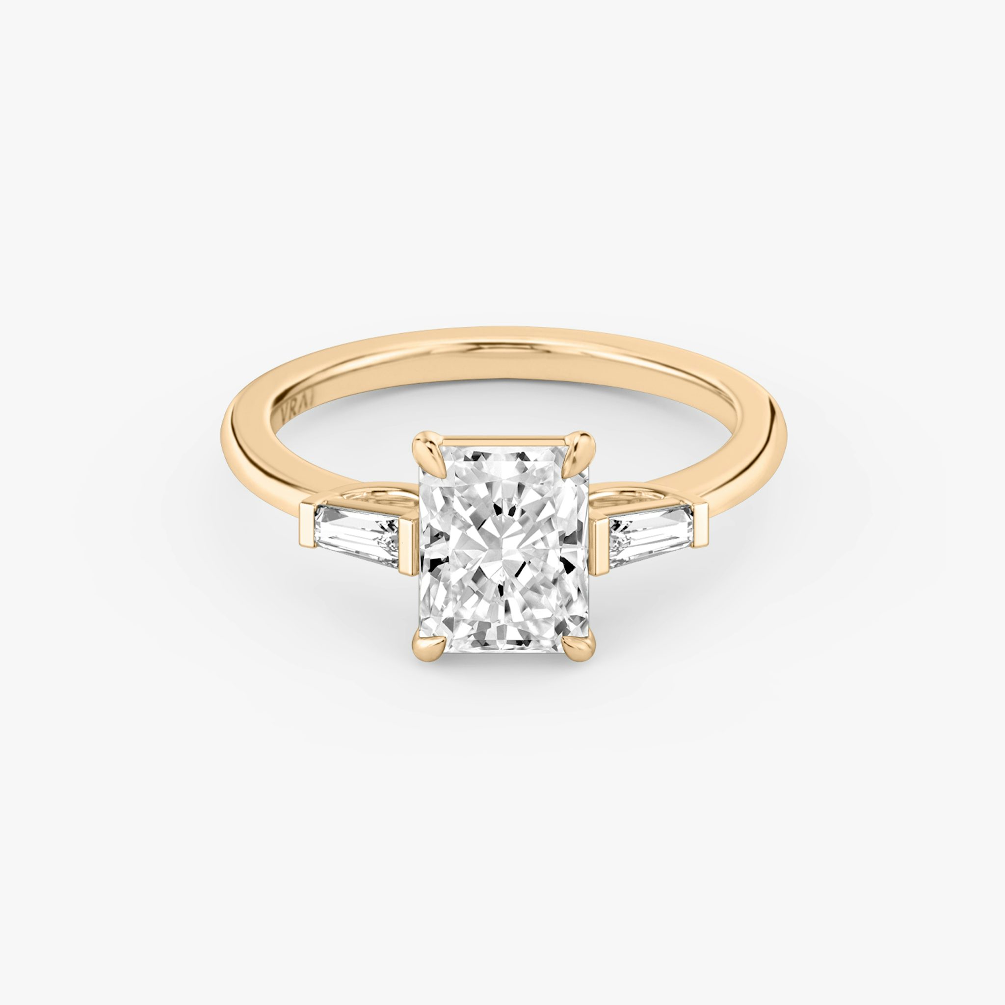 The Three Stone | Radiant | 14k | Rose Gold | bandAccent: Plain | sideStoneCarat: 0.10ct | sideStoneShape: Tapered Baguette | diamondOrientation: vertical | caratWeight: other
