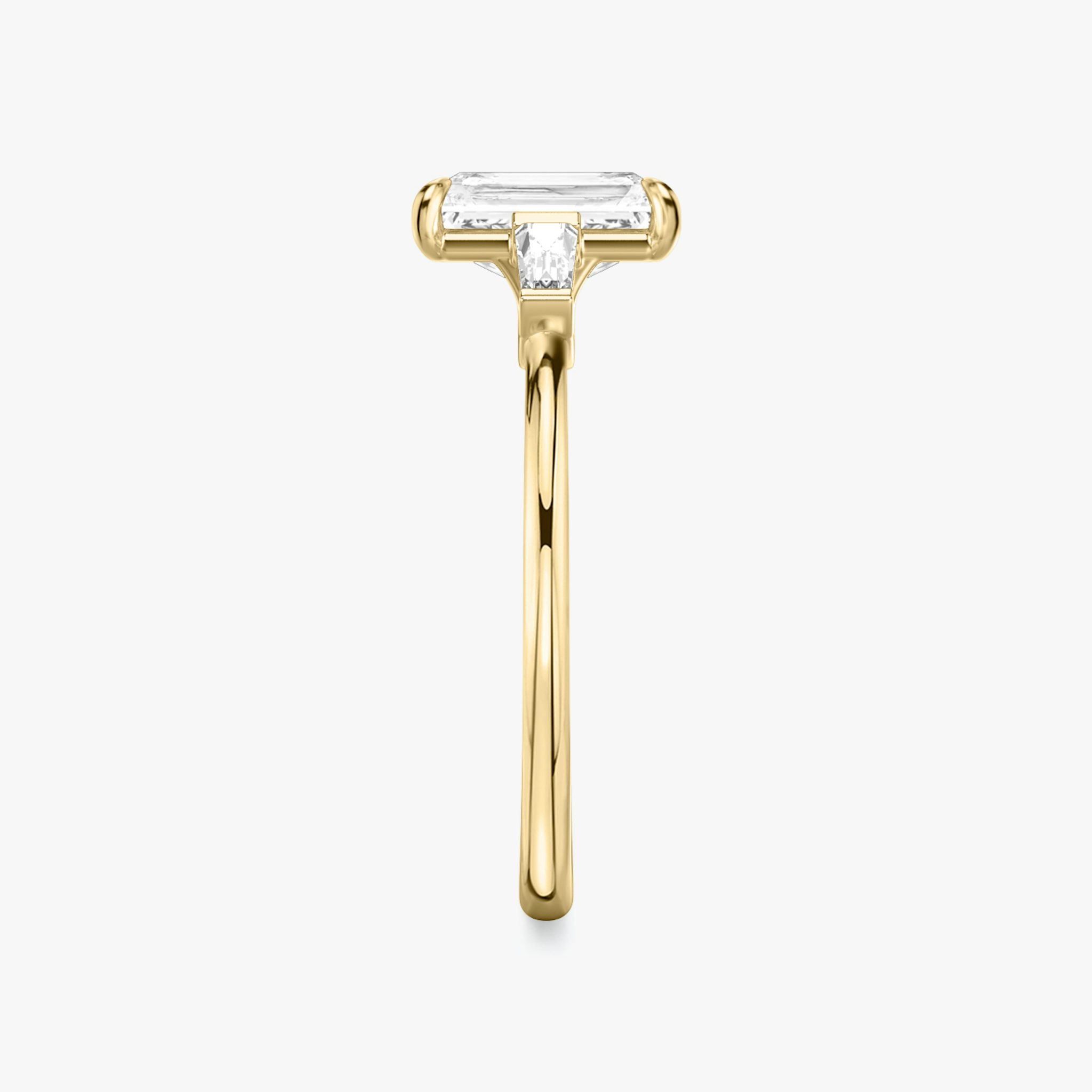 The Three Stone | Radiant | 18k | Yellow Gold | bandAccent: Plain | sideStoneCarat: 0.10ct | sideStoneShape: Tapered Baguette | diamondOrientation: vertical | caratWeight: other