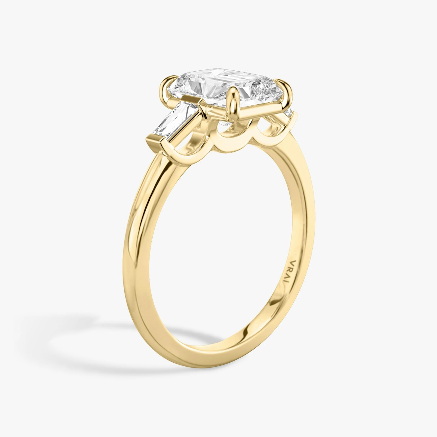 The Three Stone | Radiant | 18k | Yellow Gold | bandAccent: Plain | sideStoneCarat: 0.10ct | sideStoneShape: Tapered Baguette | diamondOrientation: vertical | caratWeight: other
