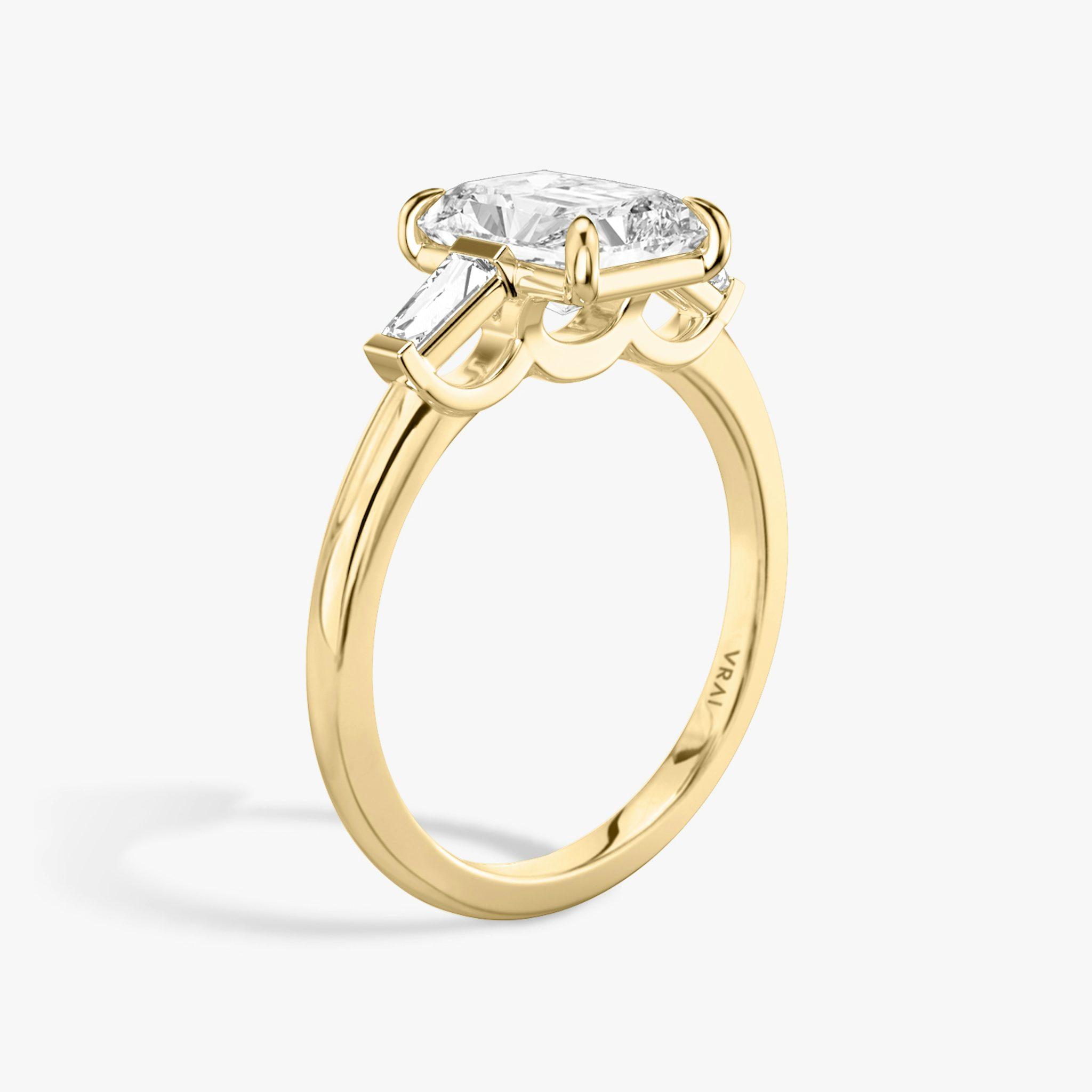 The Three Stone | Radiant | 18k | Yellow Gold | bandAccent: Plain | sideStoneCarat: 0.10ct | sideStoneShape: Tapered Baguette | diamondOrientation: vertical | caratWeight: other