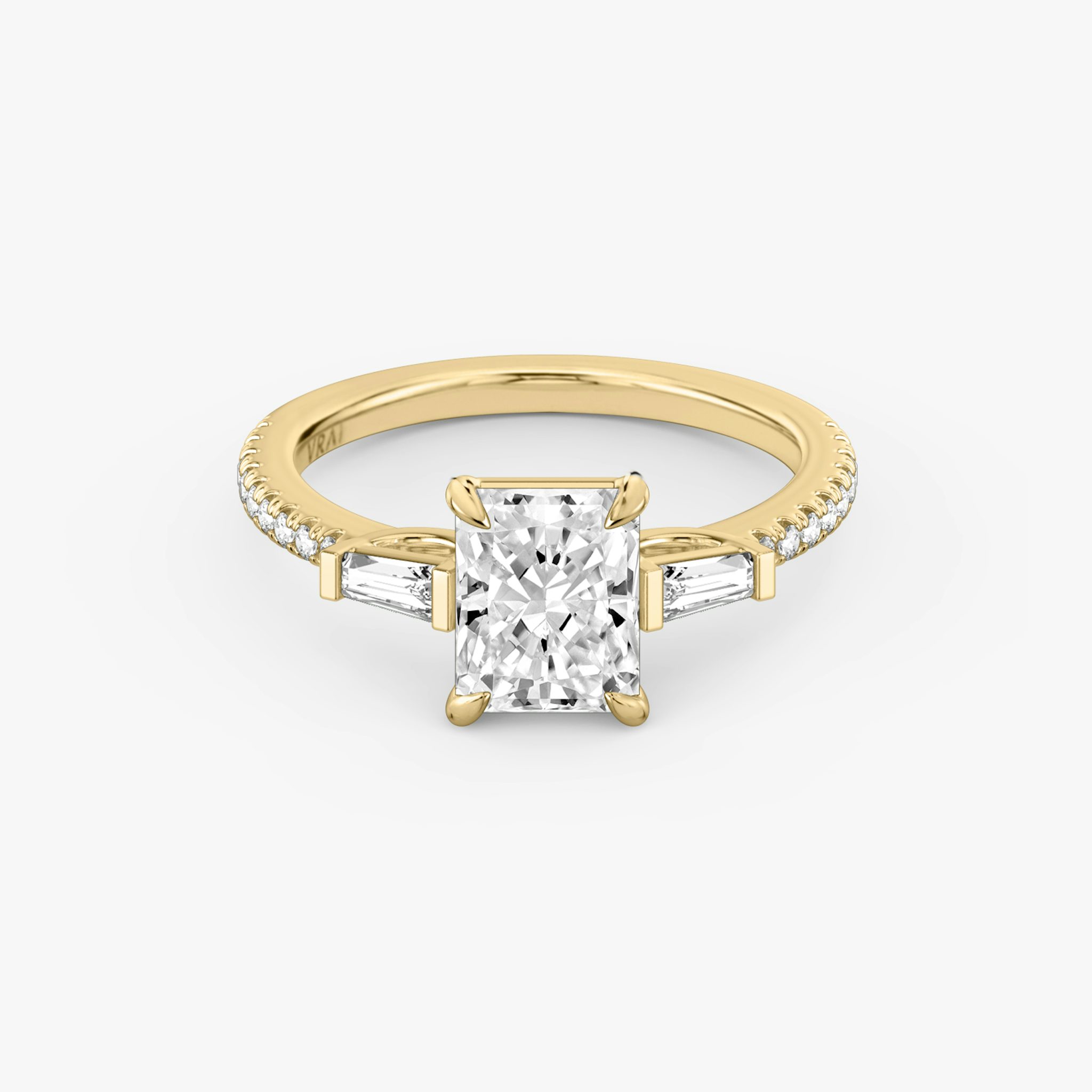 The Three Stone | Radiant | 18k | Yellow Gold | bandAccent: Pavé | sideStoneCarat: 0.10ct | sideStoneShape: Tapered Baguette | diamondOrientation: vertical | caratWeight: other