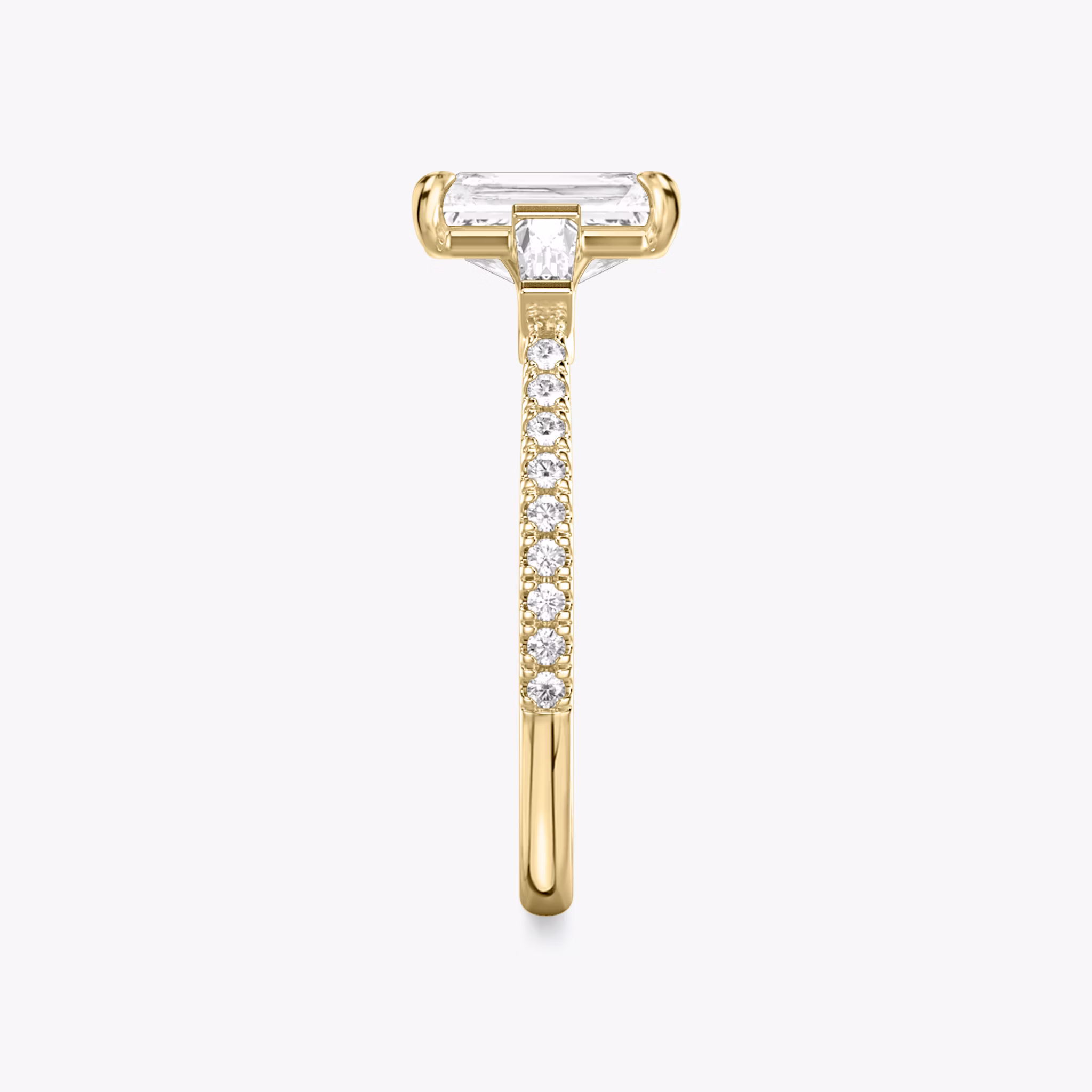 The Three Stone | Radiant | 18k | Yellow Gold | bandAccent: Pavé | sideStoneCarat: 0.10ct | sideStoneShape: Tapered Baguette | diamondOrientation: vertical | caratWeight: other