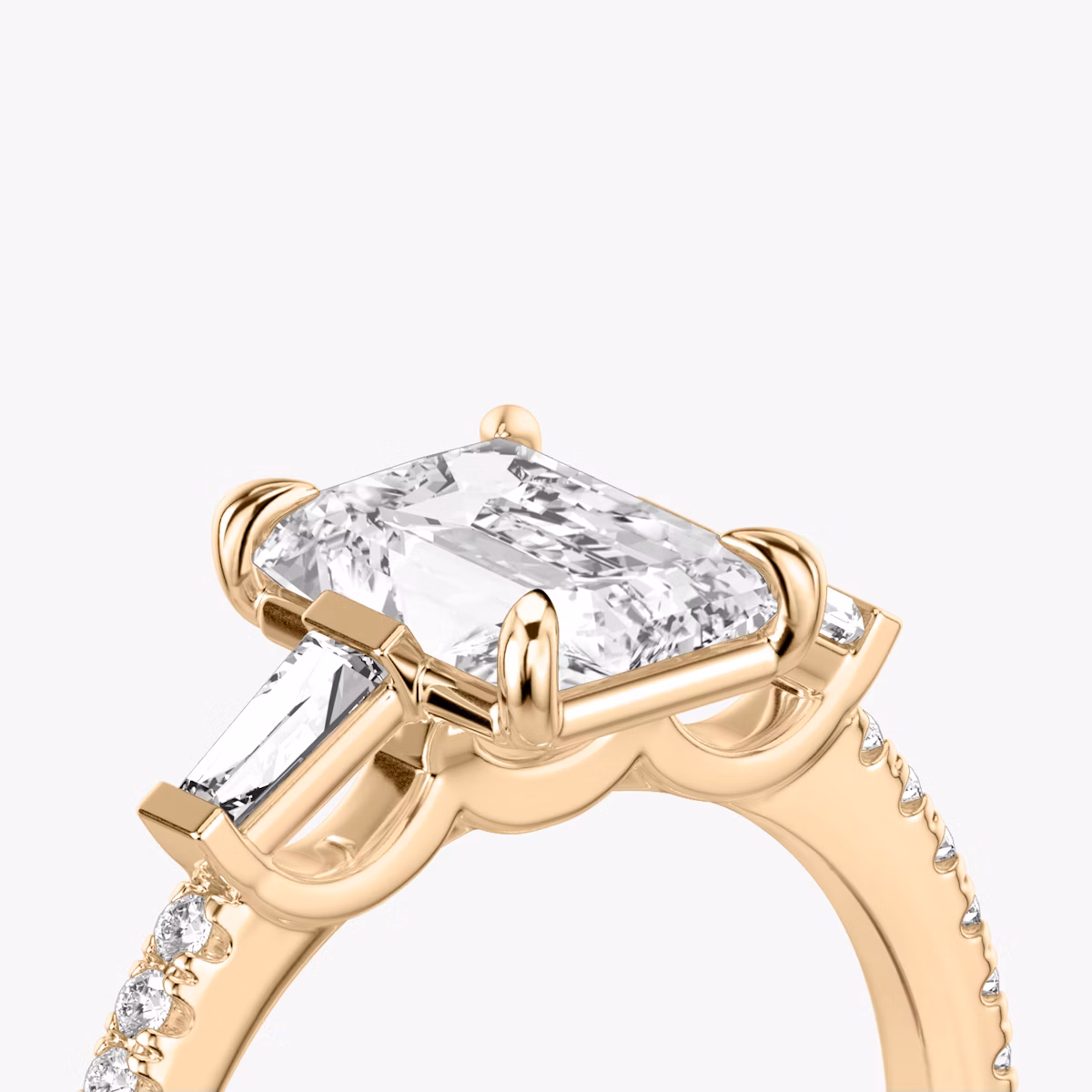 The Three Stone | Radiant | 14k | Rose Gold | bandAccent: Pavé | sideStoneCarat: 0.10ct | sideStoneShape: Tapered Baguette | diamondOrientation: vertical | caratWeight: other