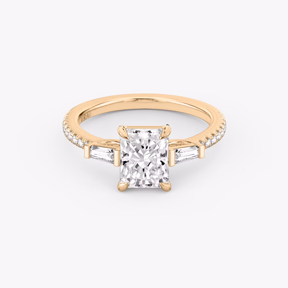 The Three Stone | Radiant | 14k | Rose Gold | bandAccent: Pavé | sideStoneCarat: 0.10ct | sideStoneShape: Tapered Baguette | diamondOrientation: vertical | caratWeight: other