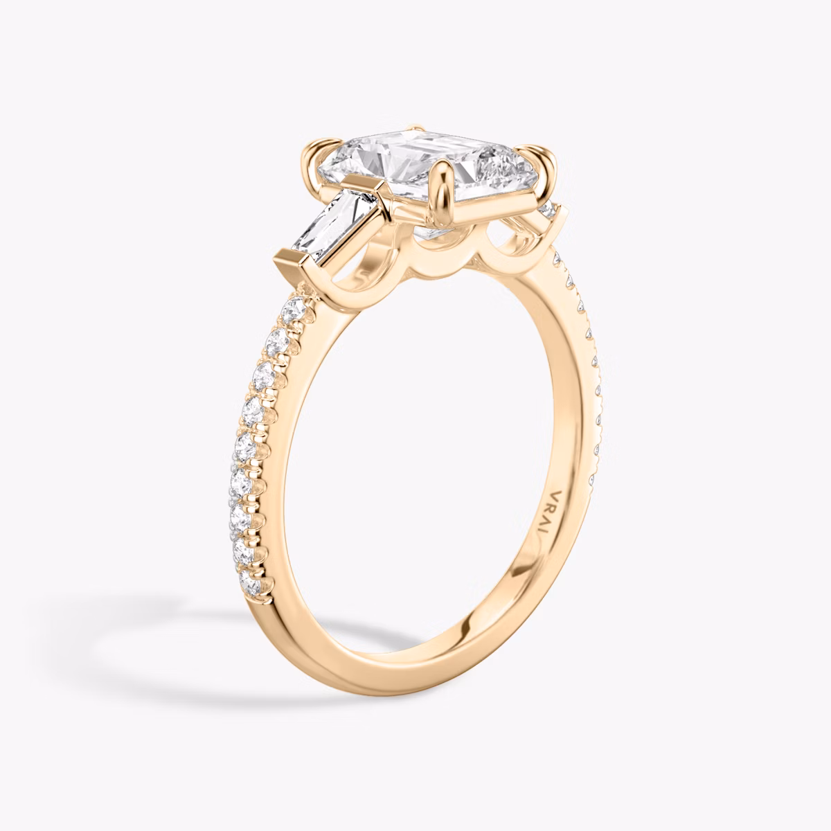 The Three Stone | Radiant | 14k | Rose Gold | bandAccent: Pavé | sideStoneCarat: 0.10ct | sideStoneShape: Tapered Baguette | diamondOrientation: vertical | caratWeight: other