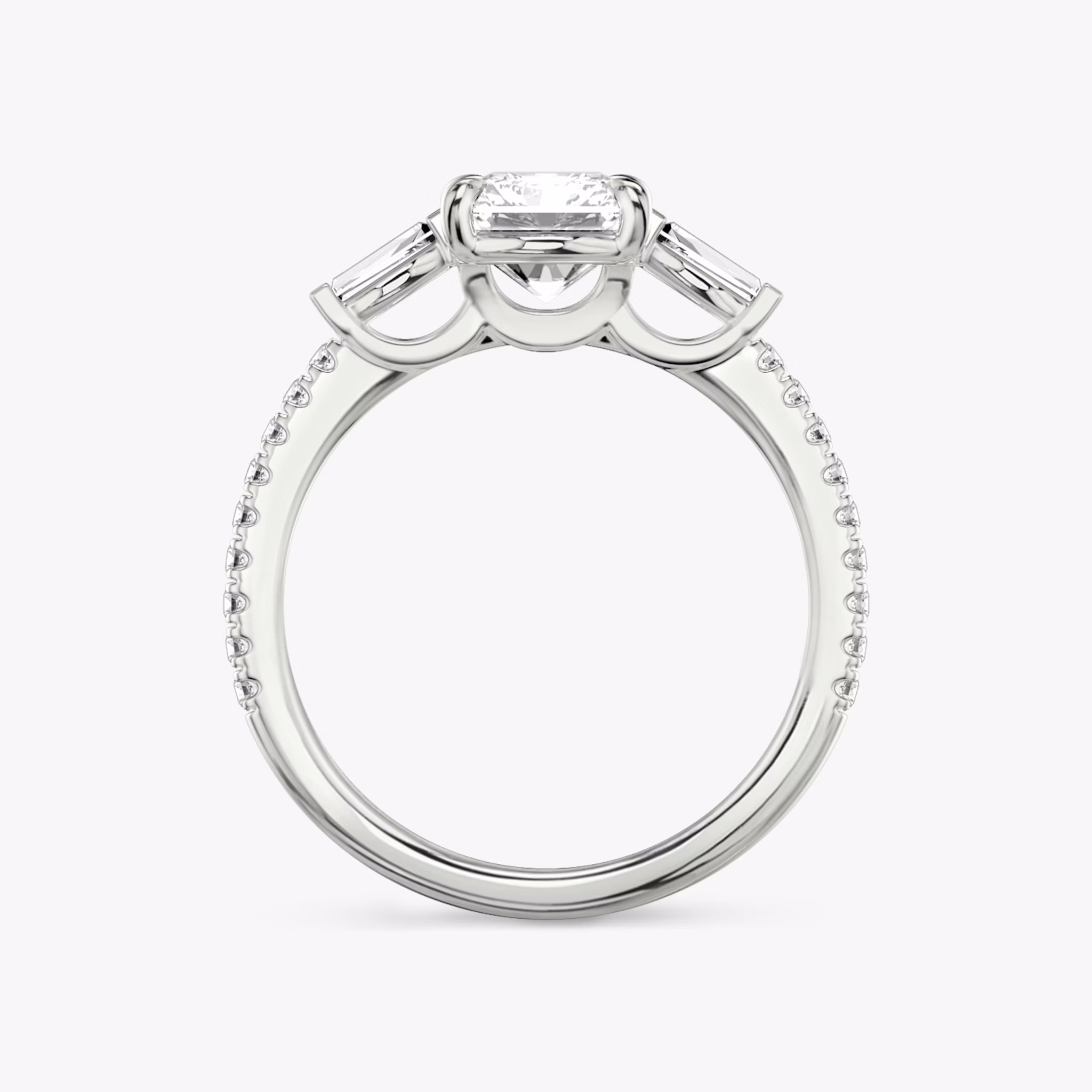 The Three Stone | Radiant | Platinum | bandAccent: Pavé | sideStoneCarat: 0.10ct | sideStoneShape: Tapered Baguette | diamondOrientation: vertical | caratWeight: other