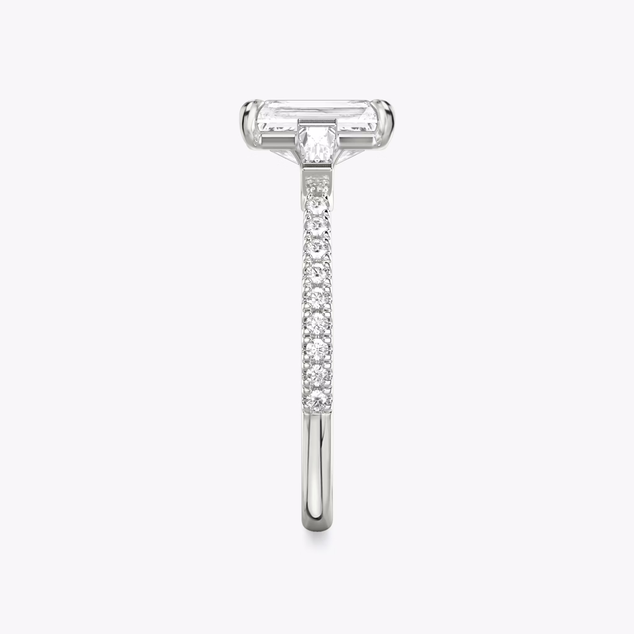 The Three Stone | Radiant | Platinum | bandAccent: Pavé | sideStoneCarat: 0.10ct | sideStoneShape: Tapered Baguette | diamondOrientation: vertical | caratWeight: other