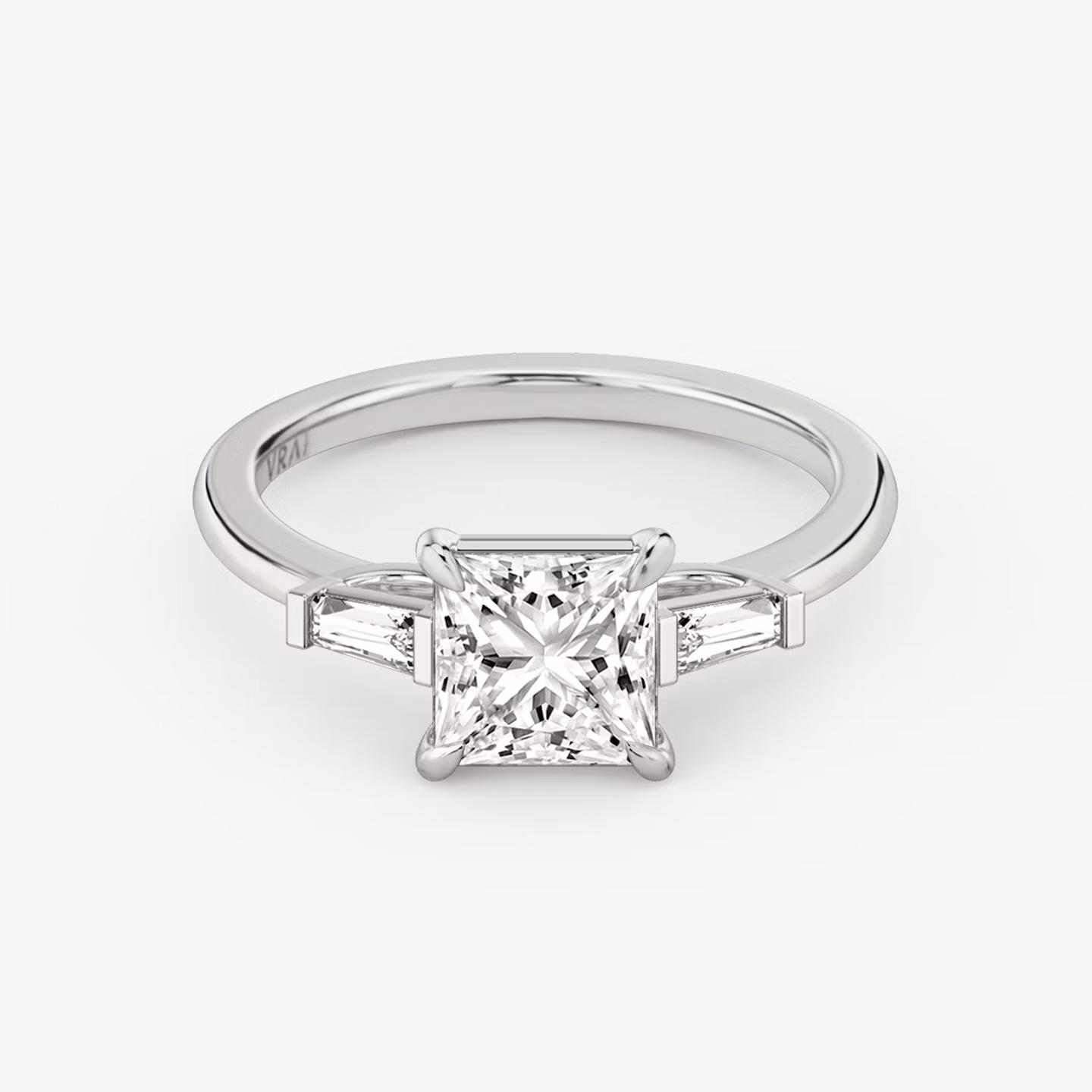 The Three Stone | Princess | 18k | White Gold | bandAccent: Plain | sideStoneCarat: 0.10ct | sideStoneShape: Tapered Baguette | diamondOrientation: vertical | caratWeight: other