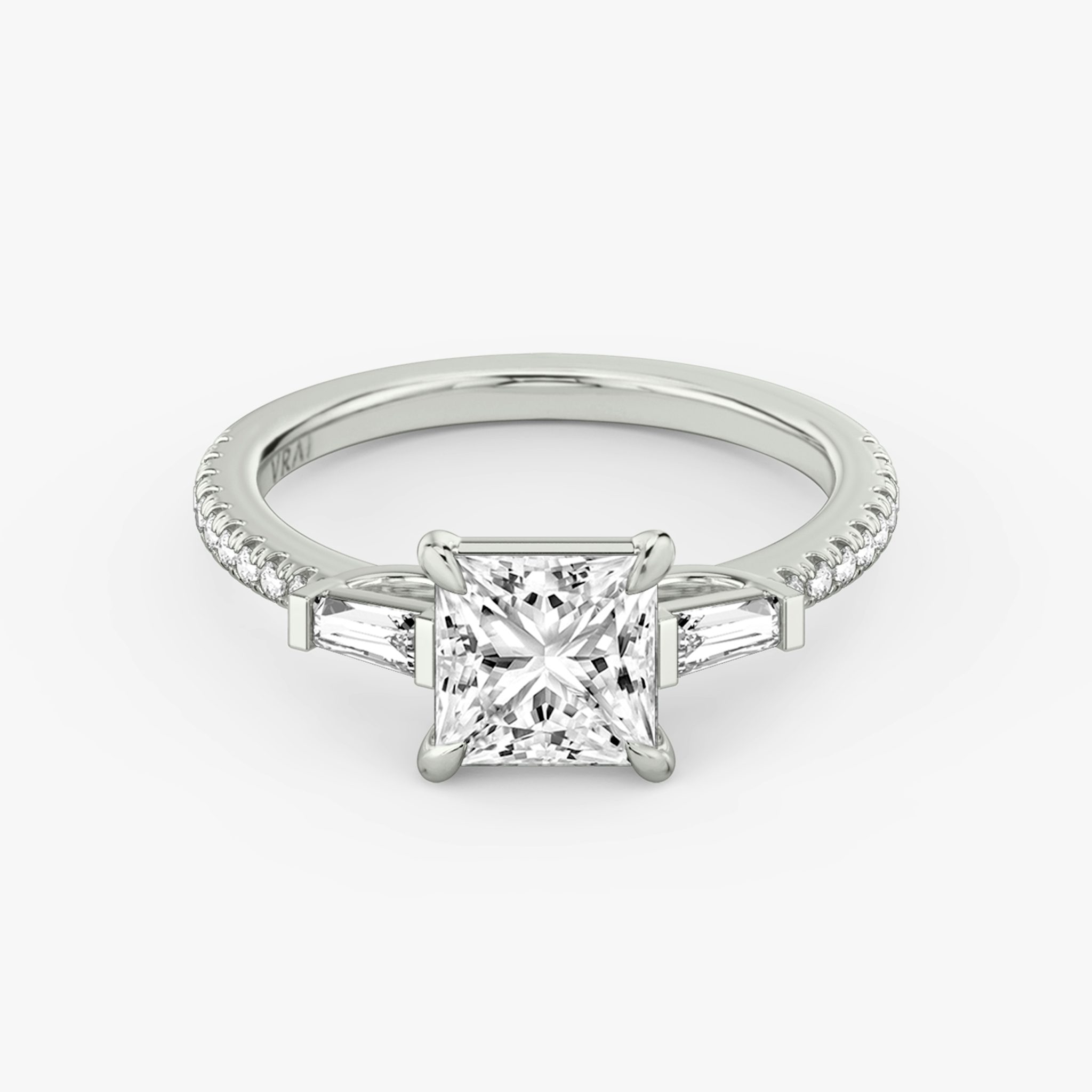 The Three Stone | Princess | Platinum | bandAccent: Pavé | sideStoneCarat: 0.10ct | sideStoneShape: Tapered Baguette | diamondOrientation: vertical | caratWeight: other