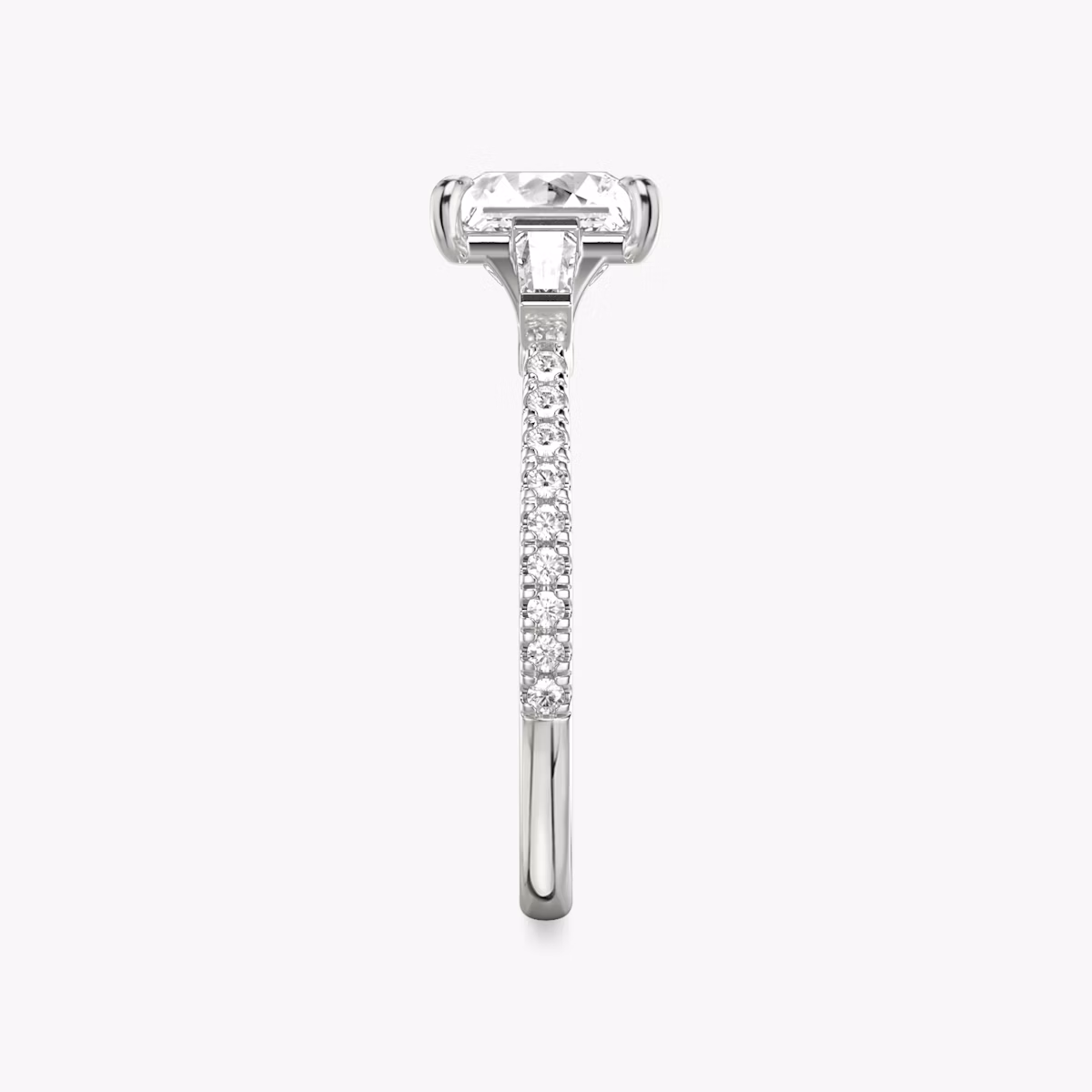 The Three Stone | Princess | Platinum | bandAccent: Pavé | sideStoneCarat: 0.10ct | sideStoneShape: Tapered Baguette | diamondOrientation: vertical | caratWeight: other