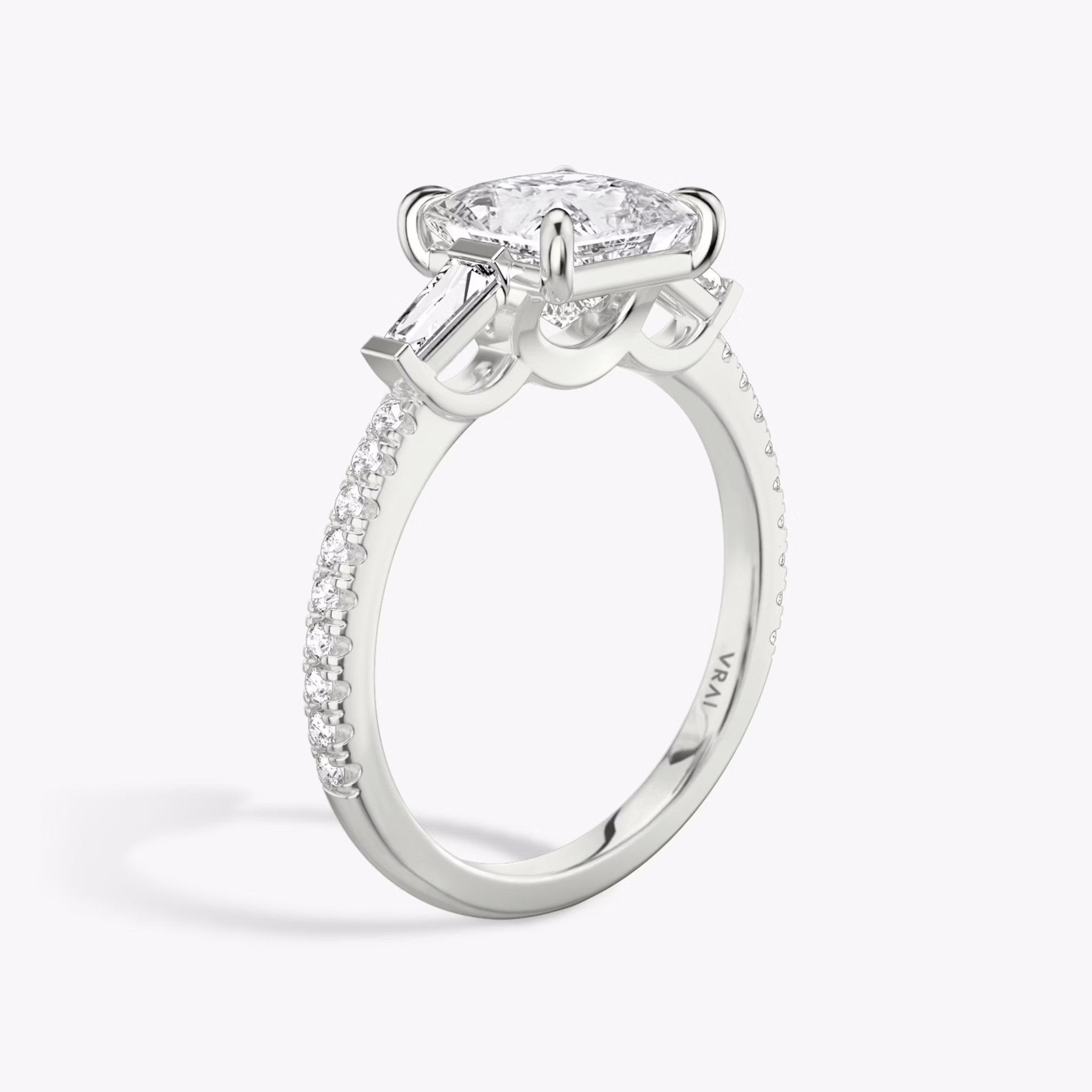 The Three Stone | Princess | Platinum | bandAccent: Pavé | sideStoneCarat: 0.10ct | sideStoneShape: Tapered Baguette | diamondOrientation: vertical | caratWeight: other