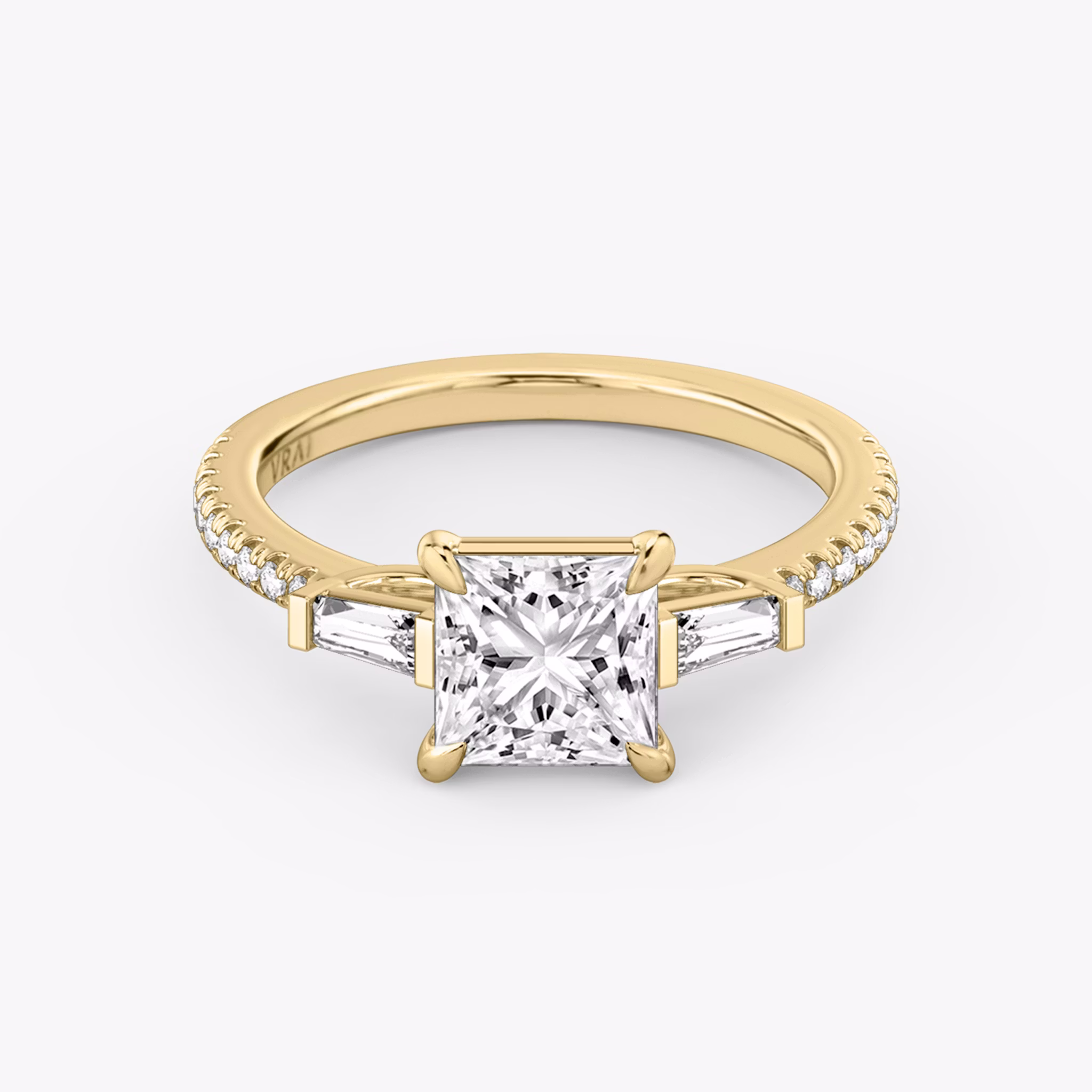 The Three Stone | Princess | 18k | Yellow Gold | bandAccent: Pavé | sideStoneCarat: 0.10ct | sideStoneShape: Tapered Baguette | diamondOrientation: vertical | caratWeight: other