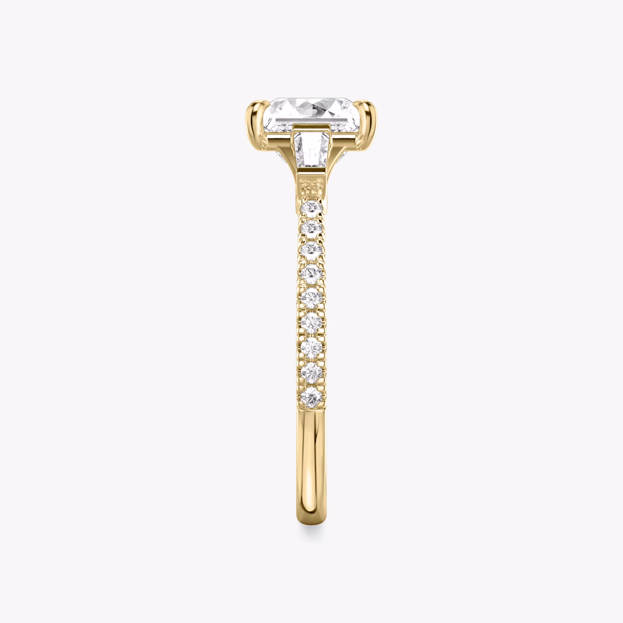 The Three Stone | Princess | 18k | Yellow Gold | bandAccent: Pavé | sideStoneCarat: 0.10ct | sideStoneShape: Tapered Baguette | diamondOrientation: vertical | caratWeight: other