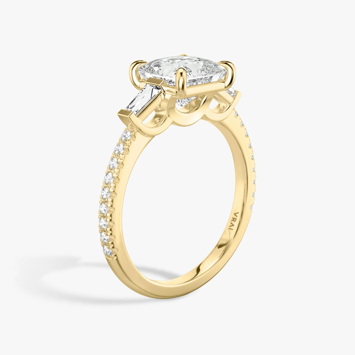 The Three Stone | Princess | 18k | Yellow Gold | bandAccent: Pavé | sideStoneCarat: 0.10ct | sideStoneShape: Tapered Baguette | diamondOrientation: vertical | caratWeight: other
