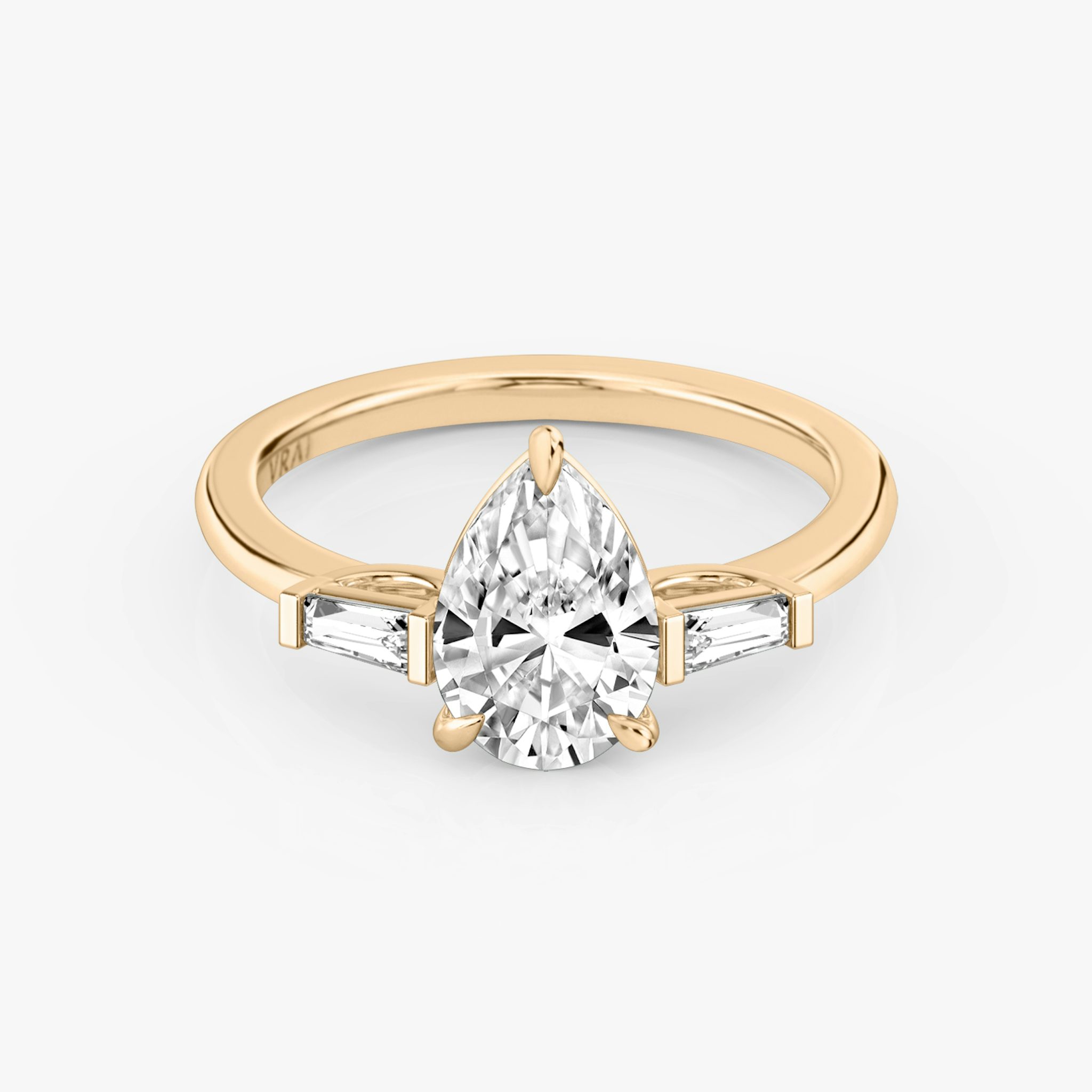 The Three Stone | Pear | 14k | Rose Gold | bandAccent: Plain | sideStoneCarat: 0.10ct | sideStoneShape: Tapered Baguette | diamondOrientation: vertical | caratWeight: other