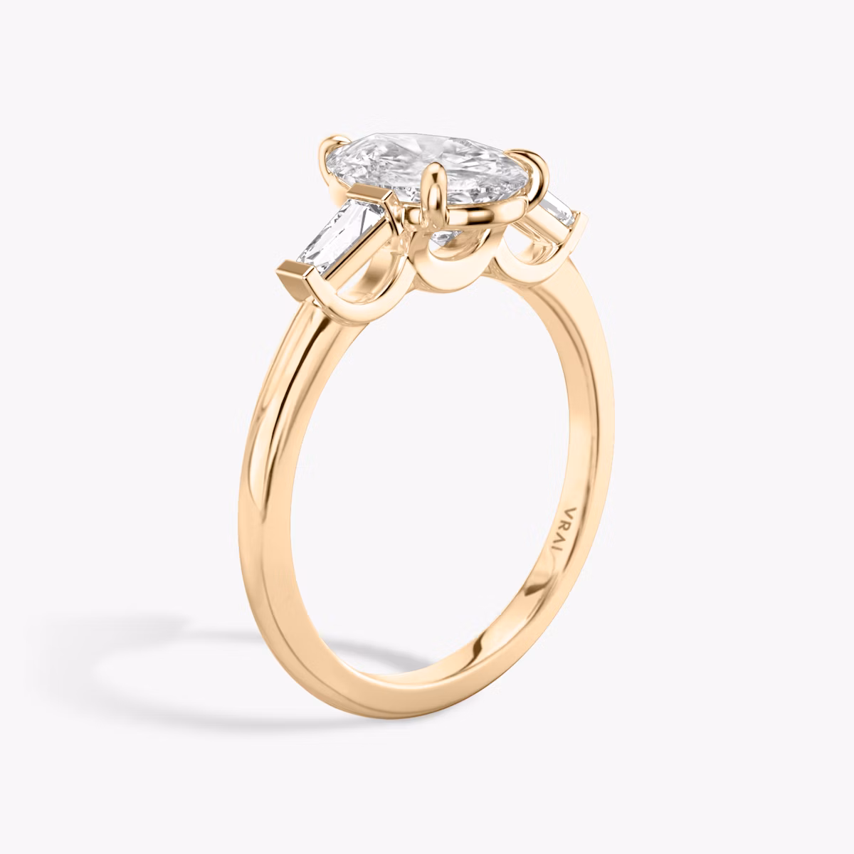 The Three Stone | Pear | 14k | Rose Gold | bandAccent: Plain | sideStoneCarat: 0.10ct | sideStoneShape: Tapered Baguette | diamondOrientation: vertical | caratWeight: other