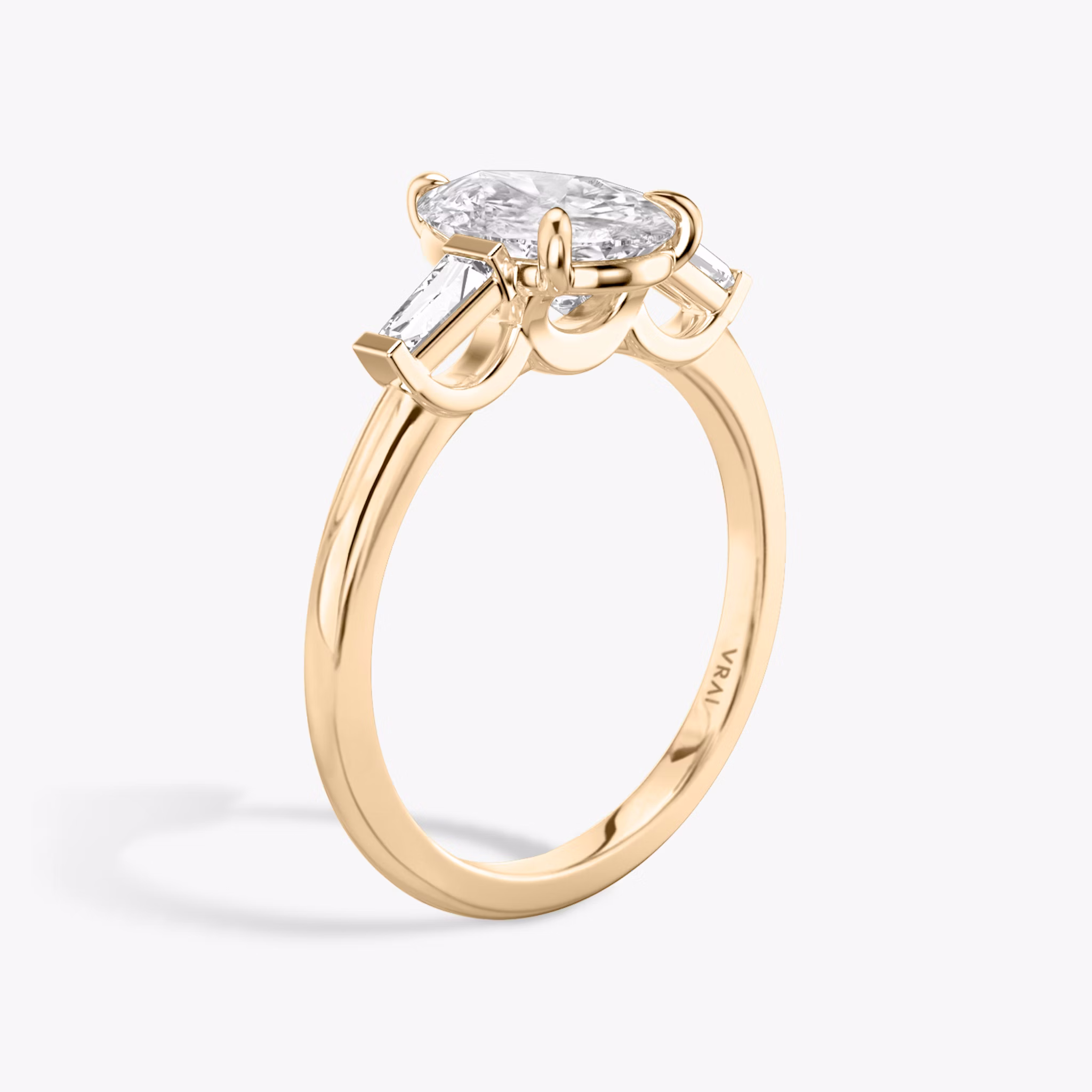 The Three Stone | Pear | 14k | Rose Gold | bandAccent: Plain | sideStoneCarat: 0.10ct | sideStoneShape: Tapered Baguette | diamondOrientation: vertical | caratWeight: other