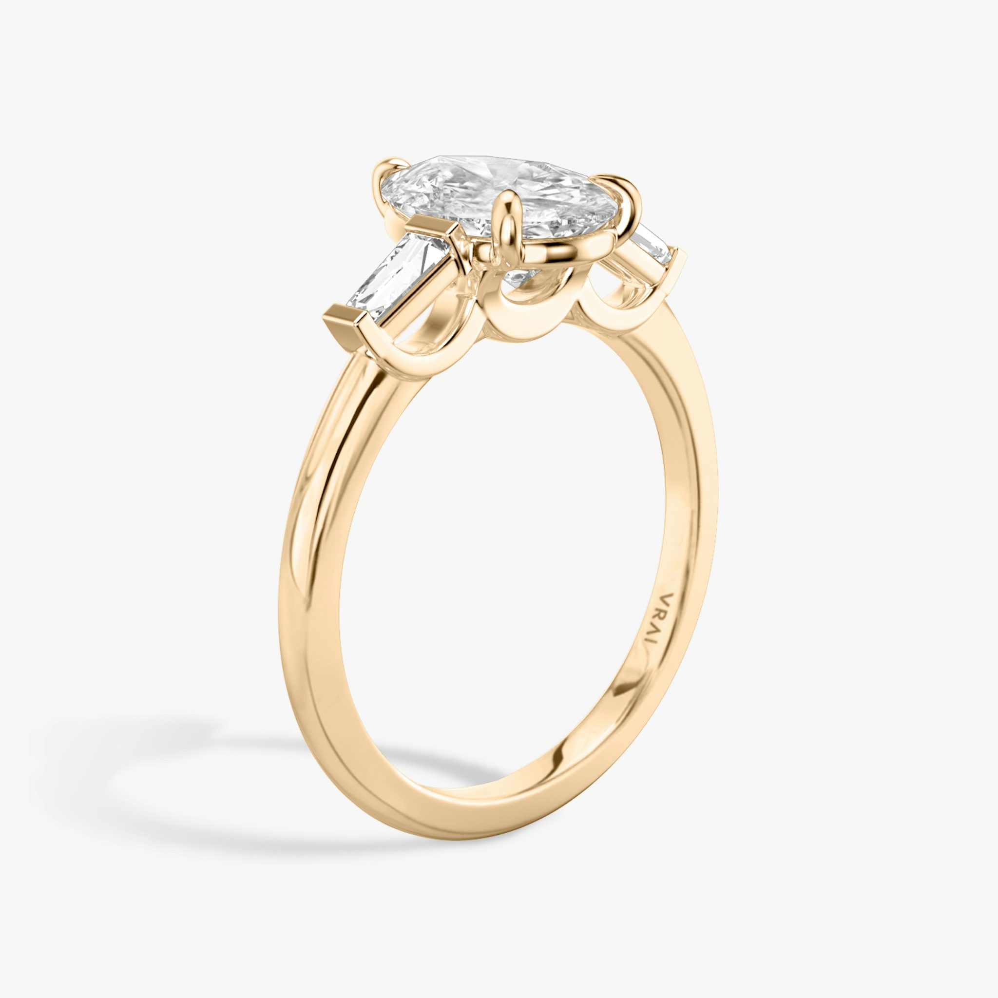 The Three Stone | Pear | 14k | Rose Gold | bandAccent: Plain | sideStoneCarat: 0.10ct | sideStoneShape: Tapered Baguette | diamondOrientation: vertical | caratWeight: other