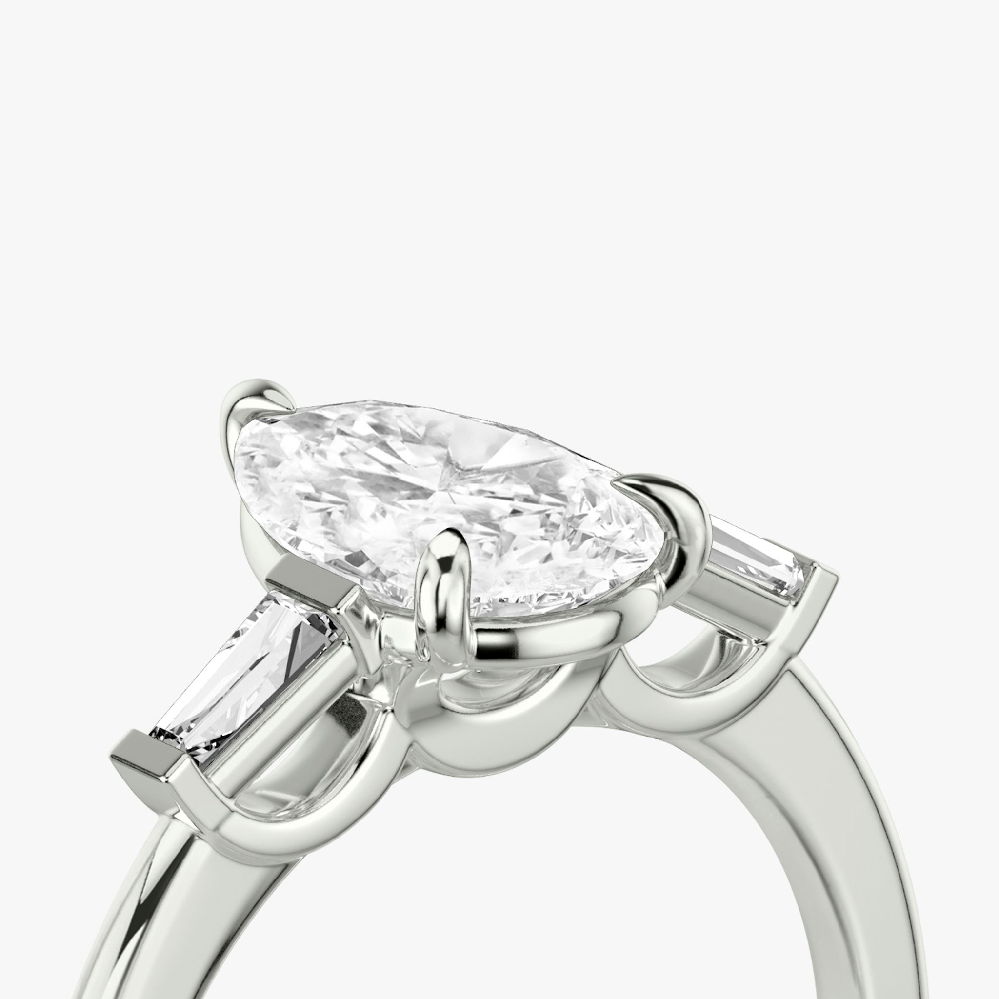 The Three Stone | Pear | Platinum | bandAccent: Plain | sideStoneCarat: 0.10ct | sideStoneShape: Tapered Baguette | diamondOrientation: vertical | caratWeight: other