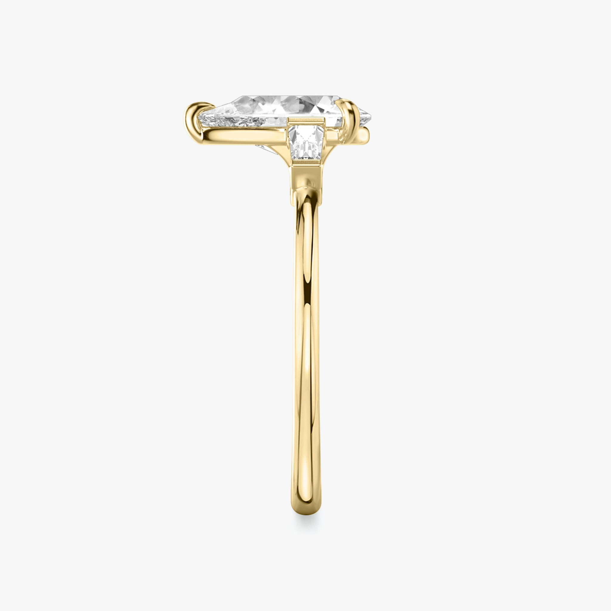 The Three Stone | Pear | 18k | Yellow Gold | bandAccent: Plain | sideStoneCarat: 0.10ct | sideStoneShape: Tapered Baguette | diamondOrientation: vertical | caratWeight: other