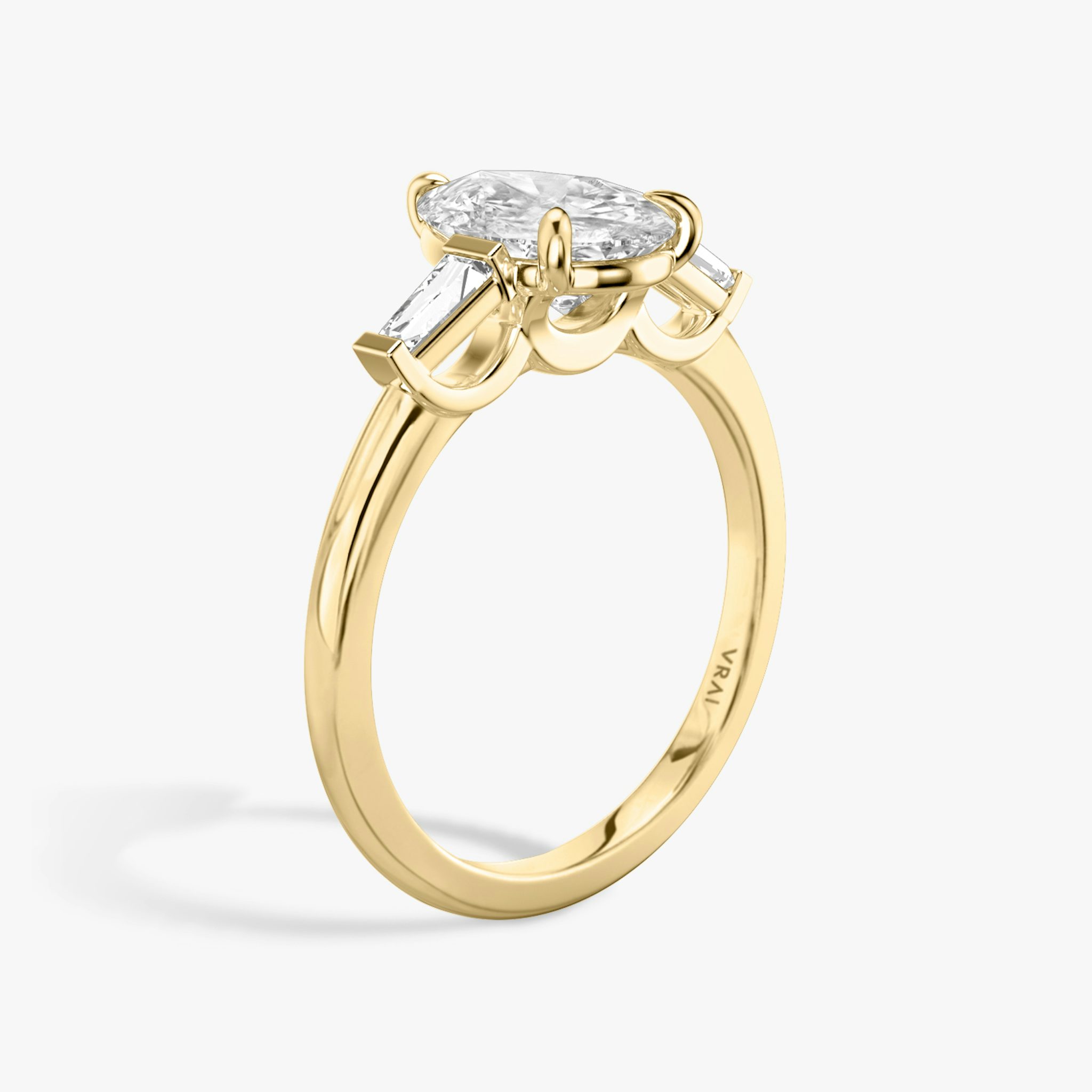 The Three Stone | Pear | 18k | Yellow Gold | bandAccent: Plain | sideStoneCarat: 0.10ct | sideStoneShape: Tapered Baguette | diamondOrientation: vertical | caratWeight: other