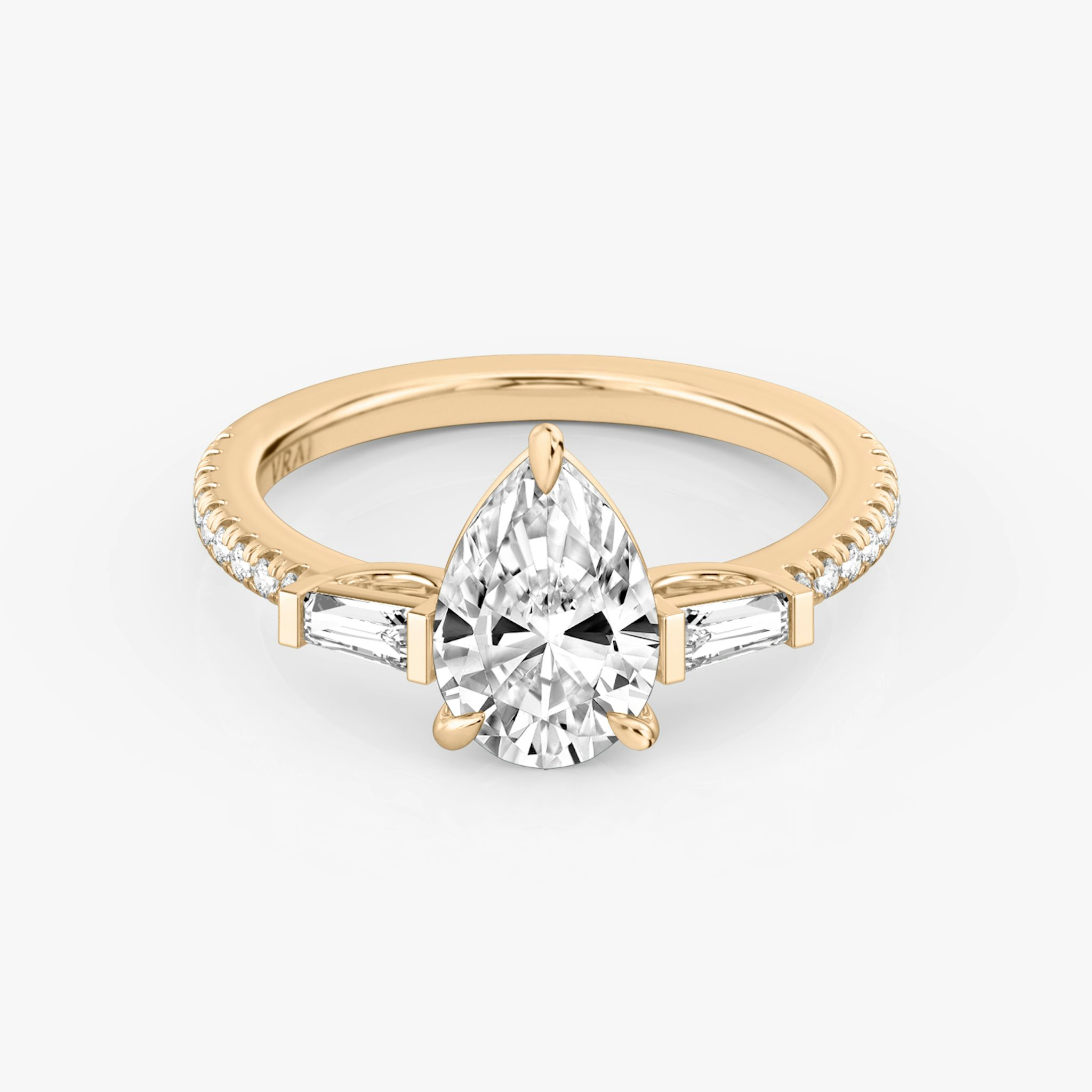 The Three Stone | Pear | 14k | Rose Gold | bandAccent: Pavé | sideStoneCarat: 0.10ct | sideStoneShape: Tapered Baguette | diamondOrientation: vertical | caratWeight: other