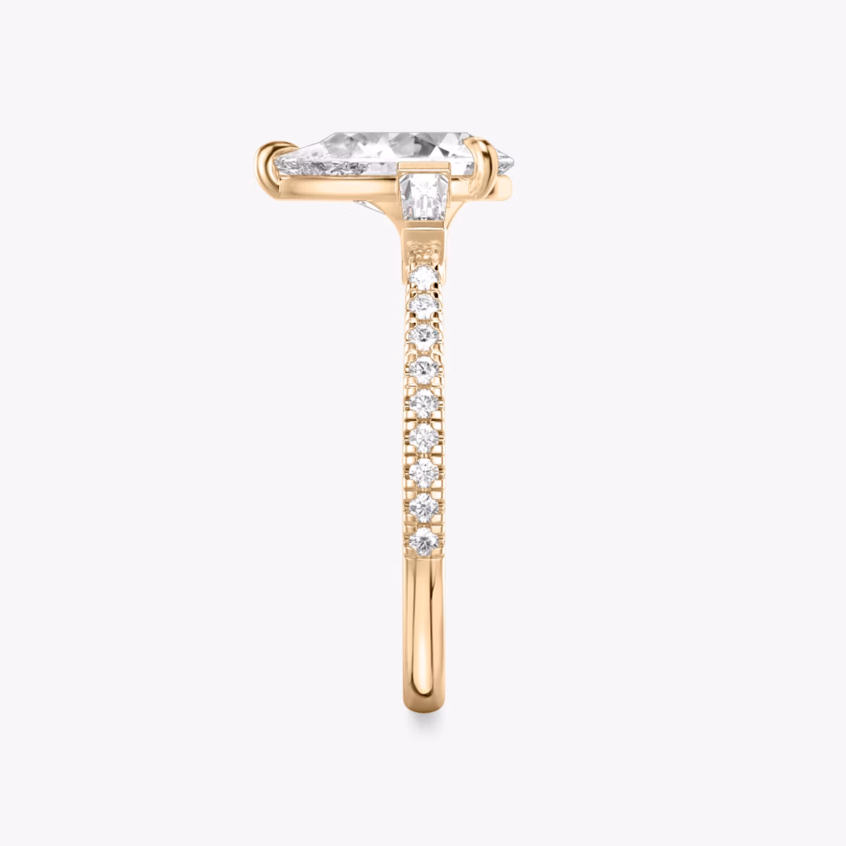 The Three Stone | Pear | 14k | Rose Gold | bandAccent: Pavé | sideStoneCarat: 0.10ct | sideStoneShape: Tapered Baguette | diamondOrientation: vertical | caratWeight: other