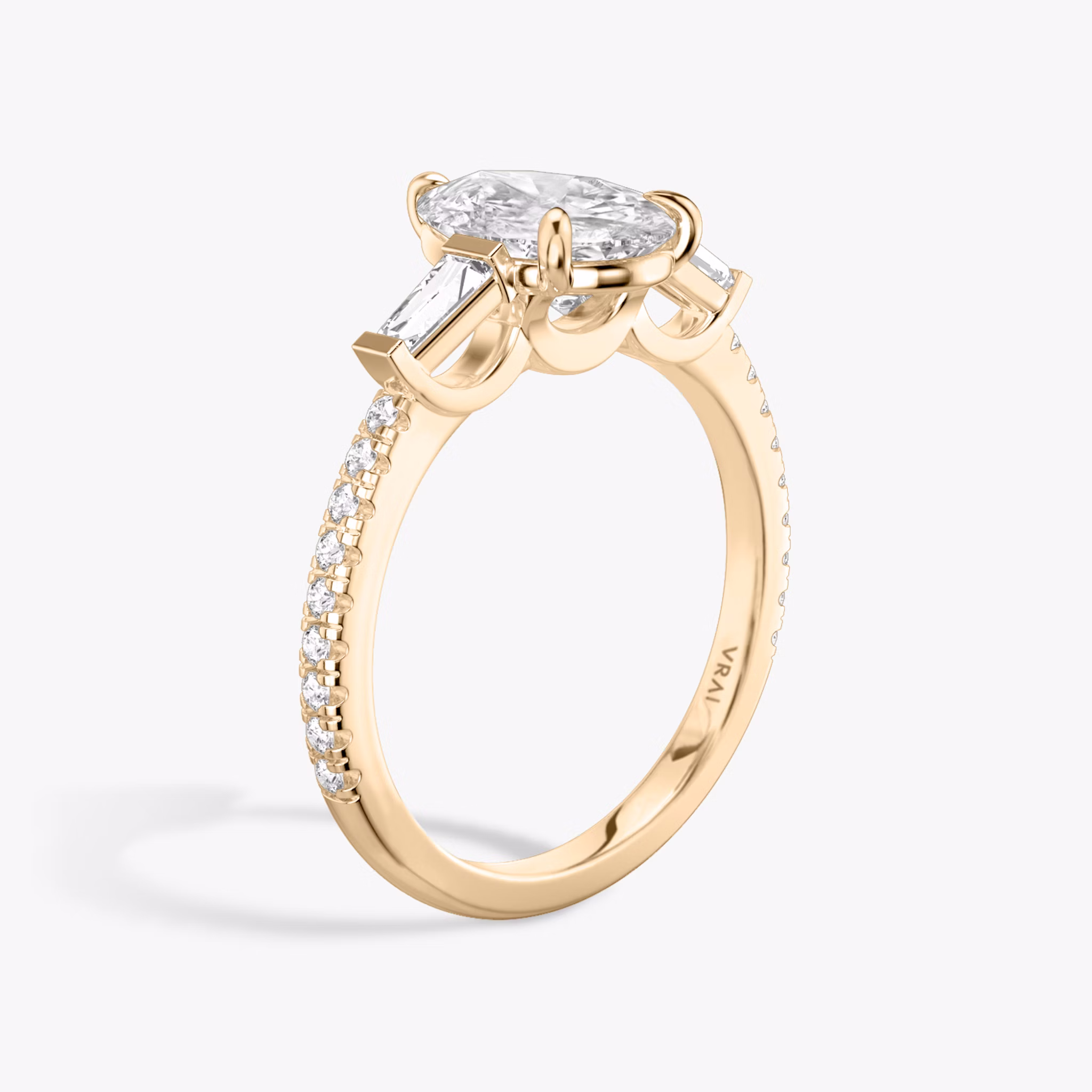 The Three Stone | Pear | 14k | Rose Gold | bandAccent: Pavé | sideStoneCarat: 0.10ct | sideStoneShape: Tapered Baguette | diamondOrientation: vertical | caratWeight: other