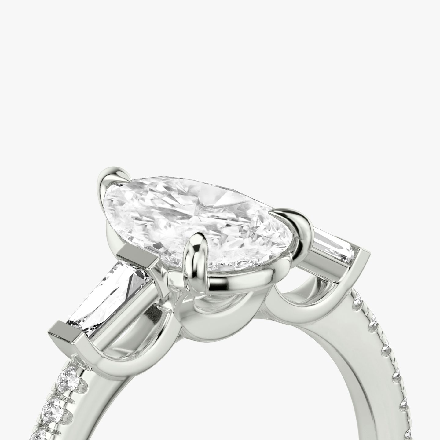 The Three Stone | Pear | Platinum | bandAccent: Pavé | sideStoneCarat: 0.10ct | sideStoneShape: Tapered Baguette | diamondOrientation: vertical | caratWeight: other