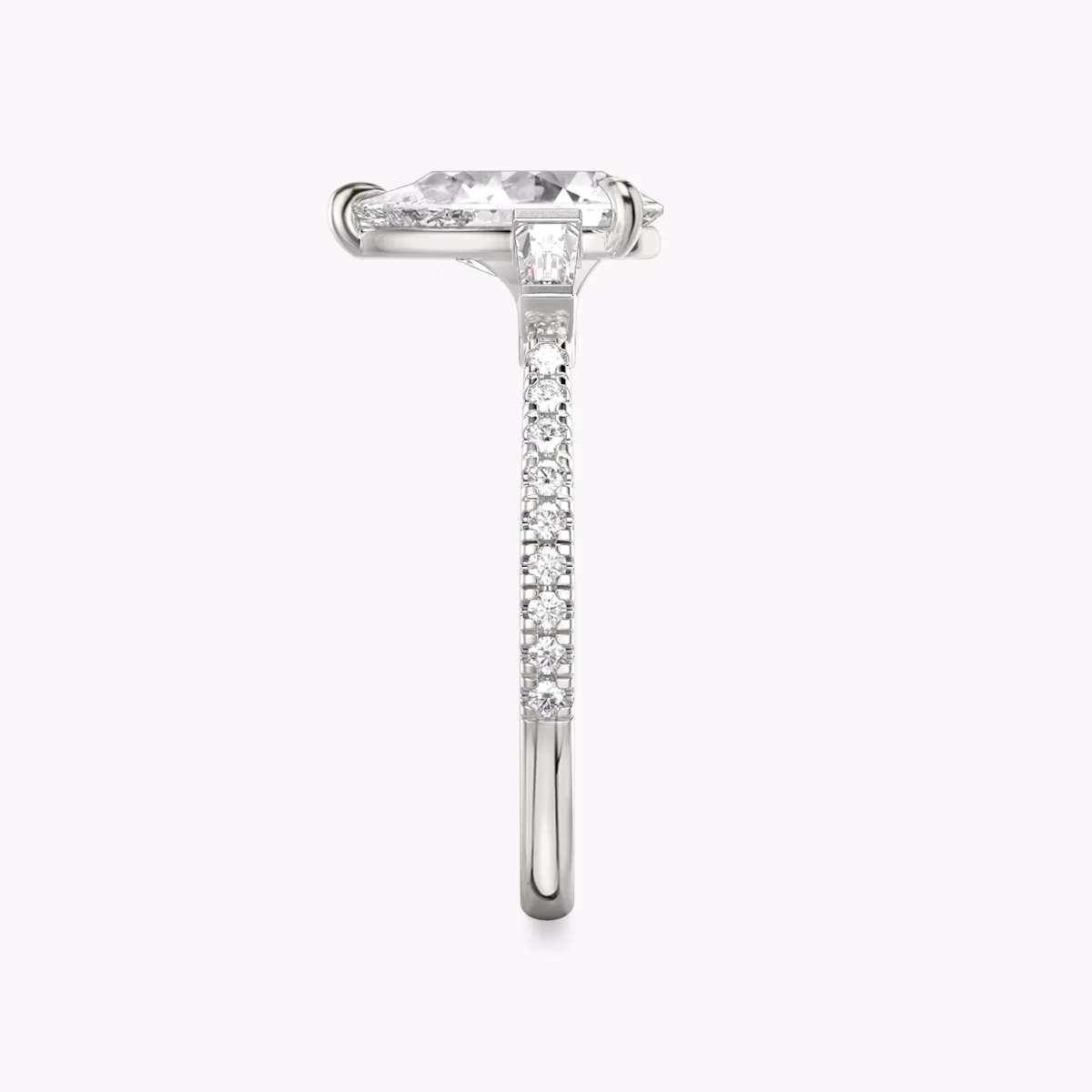 The Three Stone | Pear | 18k | White Gold | bandAccent: Pavé | sideStoneCarat: 0.10ct | sideStoneShape: Tapered Baguette | diamondOrientation: vertical | caratWeight: other