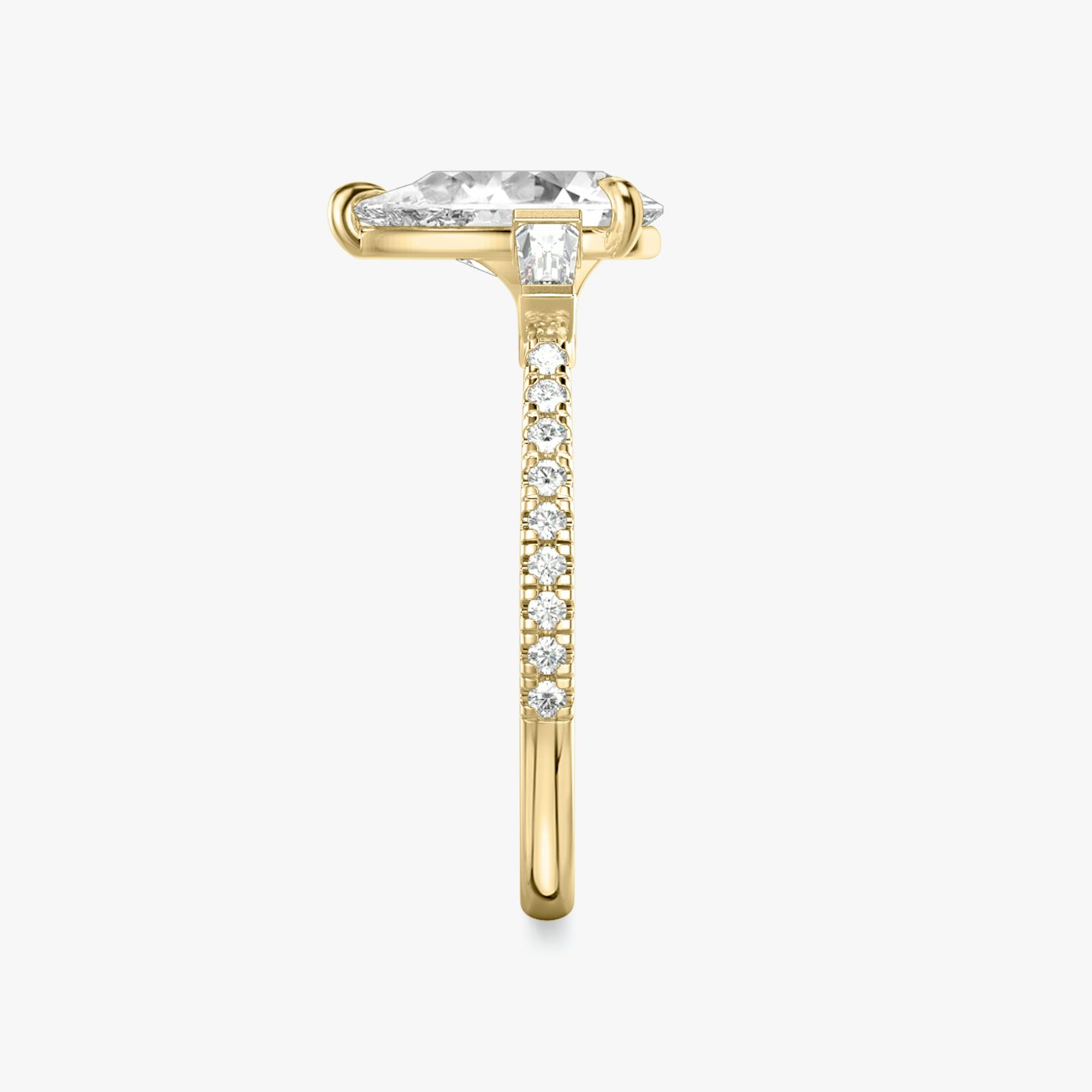 The Three Stone | Pear | 18k | Yellow Gold | bandAccent: Pavé | sideStoneCarat: 0.10ct | sideStoneShape: Tapered Baguette | diamondOrientation: vertical | caratWeight: other