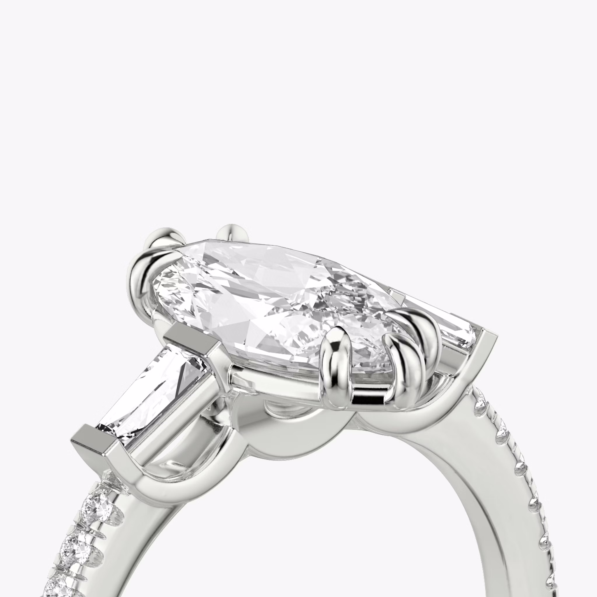 The Three Stone | Marquise | Platinum | bandAccent: Pavé | sideStoneCarat: 0.10ct | sideStoneShape: Tapered Baguette | diamondOrientation: vertical | caratWeight: other