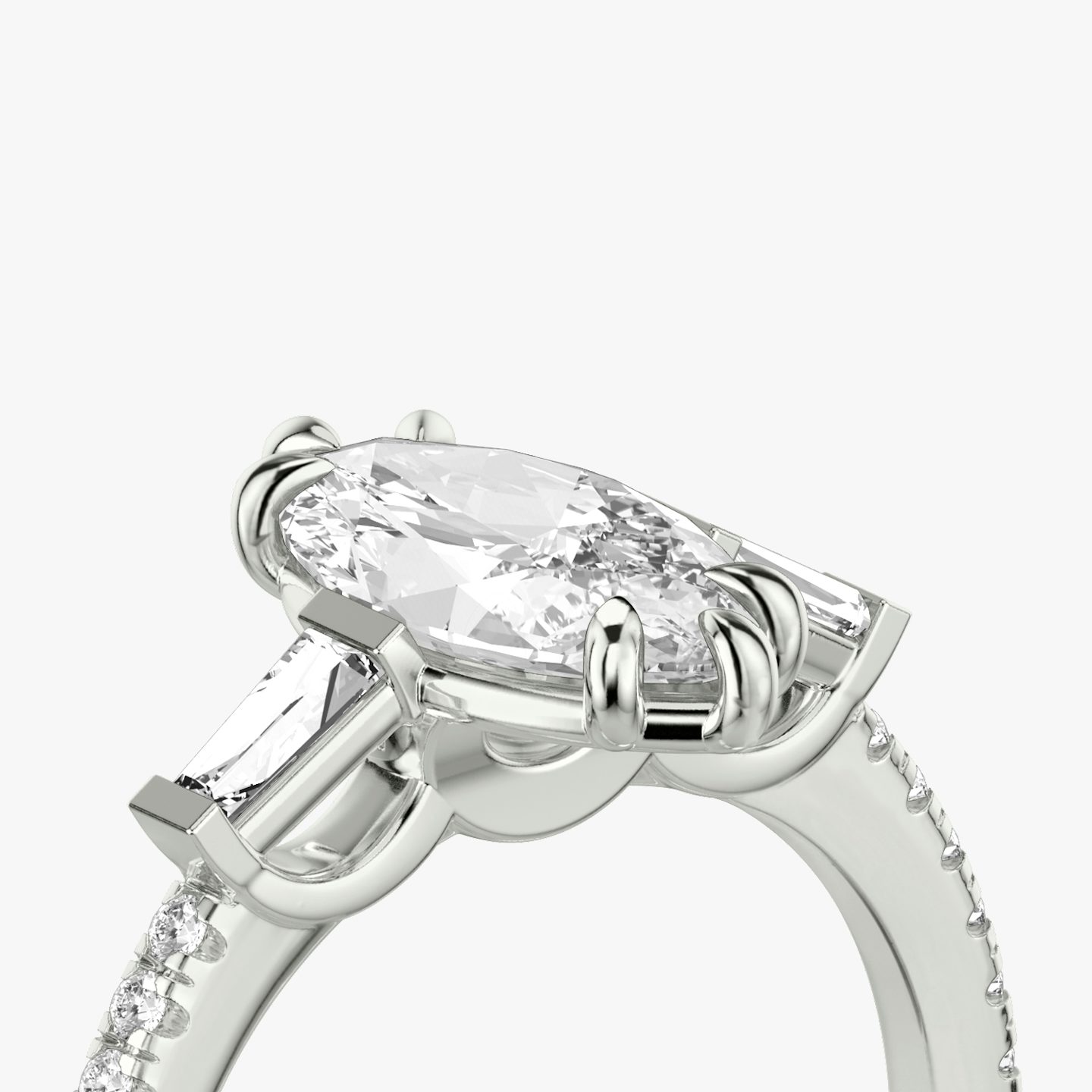 The Three Stone | Marquise | Platinum | bandAccent: Pavé | sideStoneCarat: 0.10ct | sideStoneShape: Tapered Baguette | diamondOrientation: vertical | caratWeight: other
