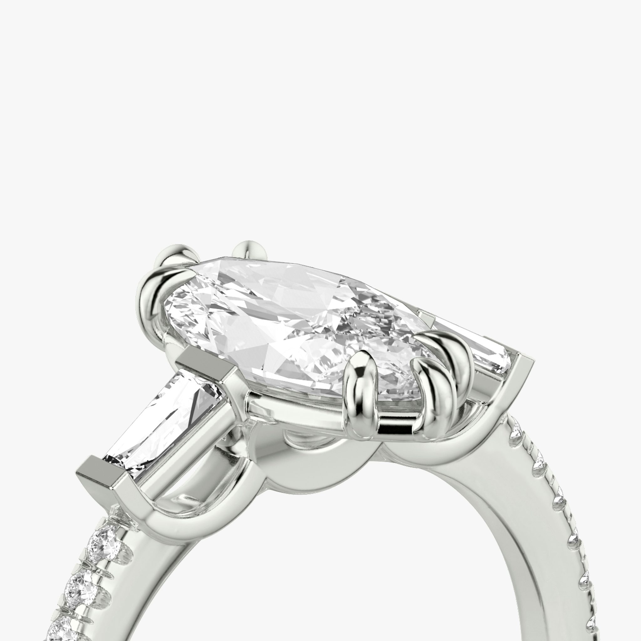 The Three Stone | Marquise | Platinum | bandAccent: Pavé | sideStoneCarat: 0.10ct | sideStoneShape: Tapered Baguette | diamondOrientation: vertical | caratWeight: other