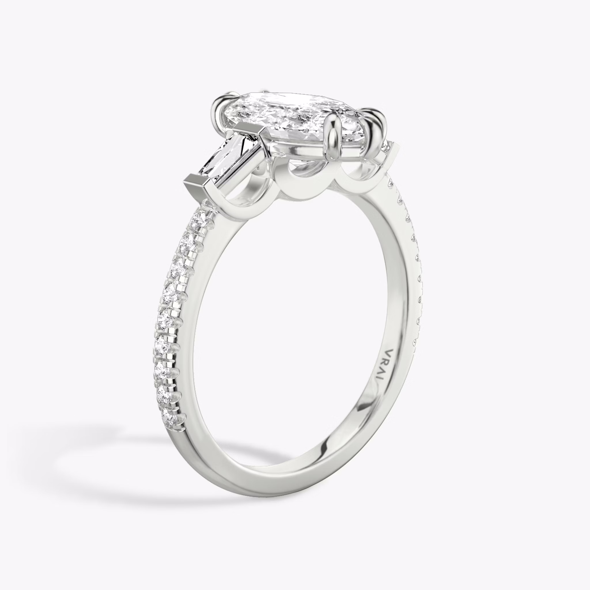 The Three Stone | Marquise | Platinum | bandAccent: Pavé | sideStoneCarat: 0.10ct | sideStoneShape: Tapered Baguette | diamondOrientation: vertical | caratWeight: other