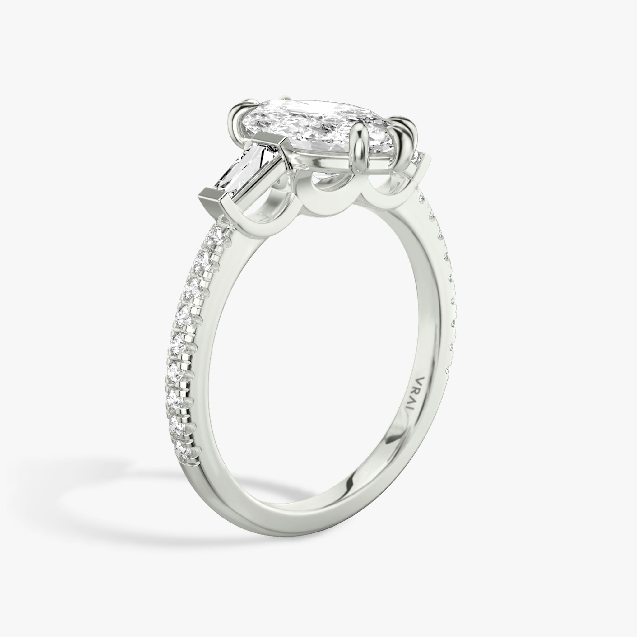 The Three Stone | Marquise | Platinum | bandAccent: Pavé | sideStoneCarat: 0.10ct | sideStoneShape: Tapered Baguette | diamondOrientation: vertical | caratWeight: other